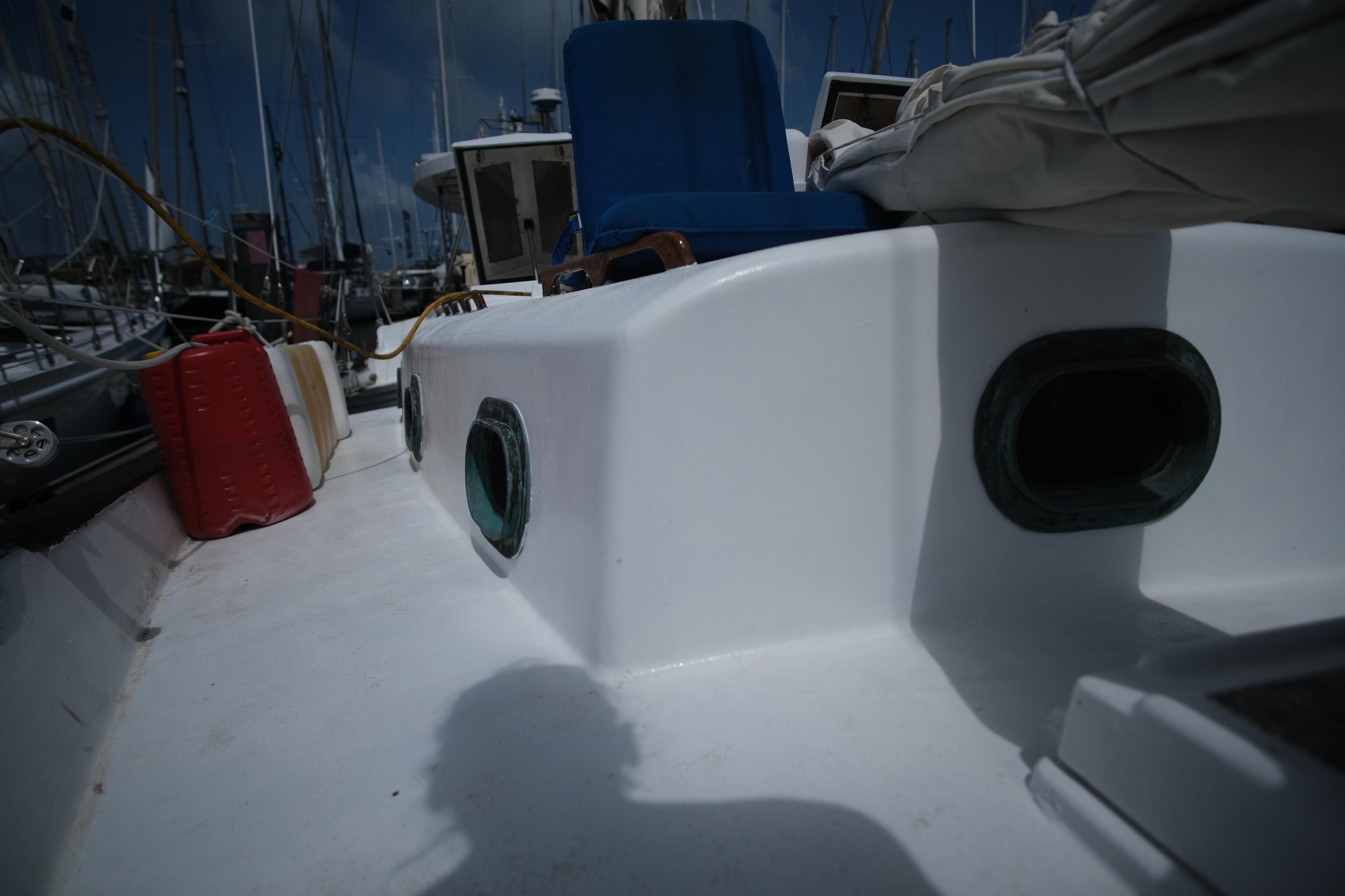 1978 CYS Walkover 44 boat deck with blue seat and red fuel container.