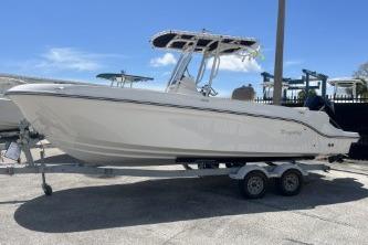 2023 Trophy T24 CC boat on trailer under clear blue sky.