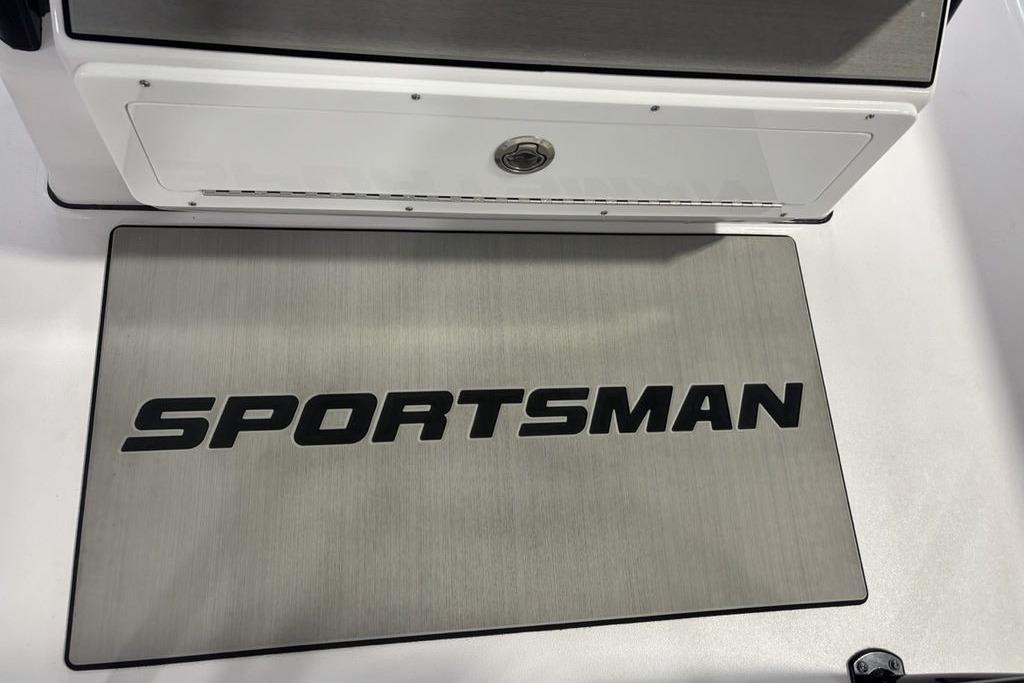 2026 Sportsman Masters 247 Bay Boat deck with logo, showcasing sleek design.