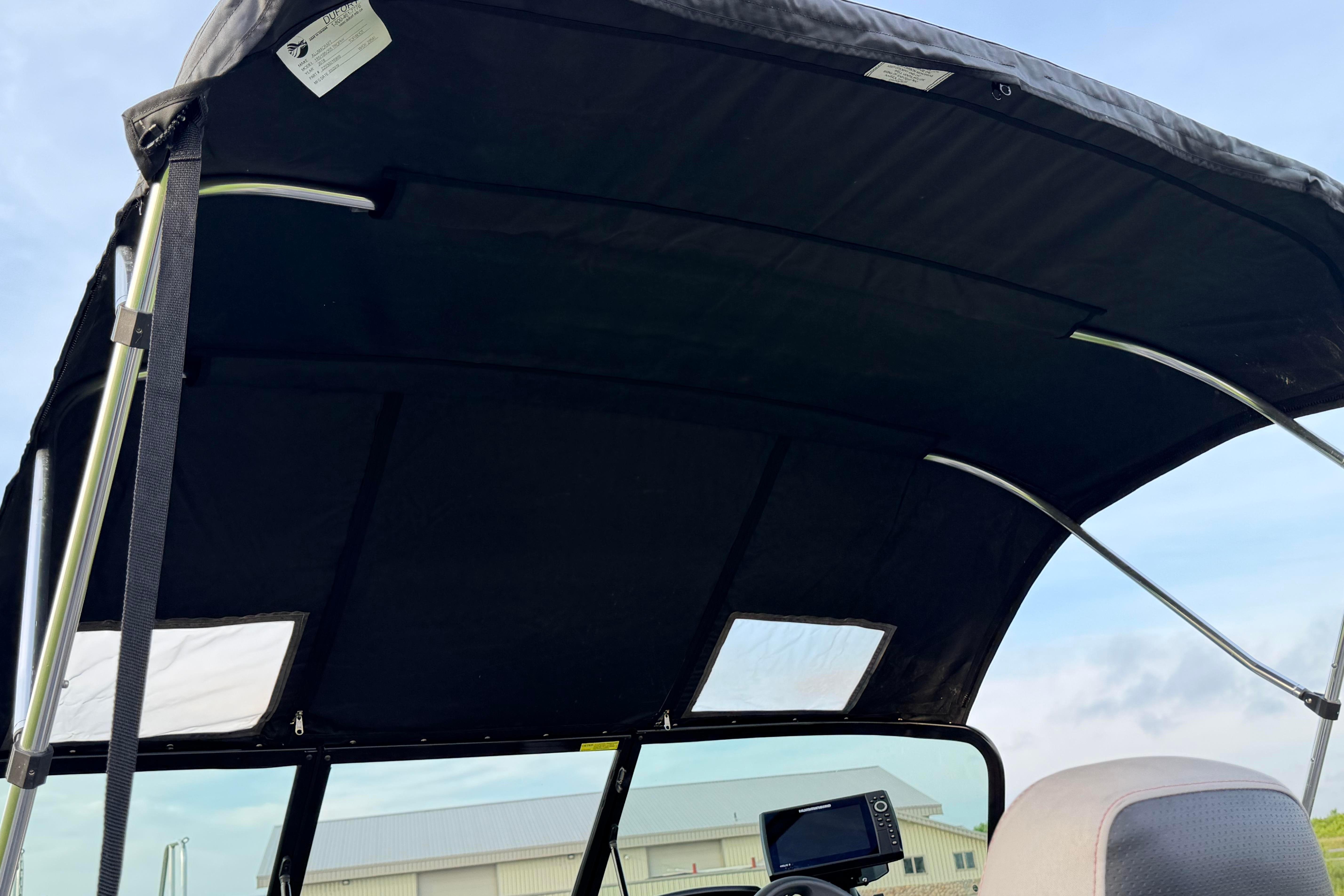 2019 Alumacraft Trophy 205 boat canopy with sturdy frame and clear sky background.