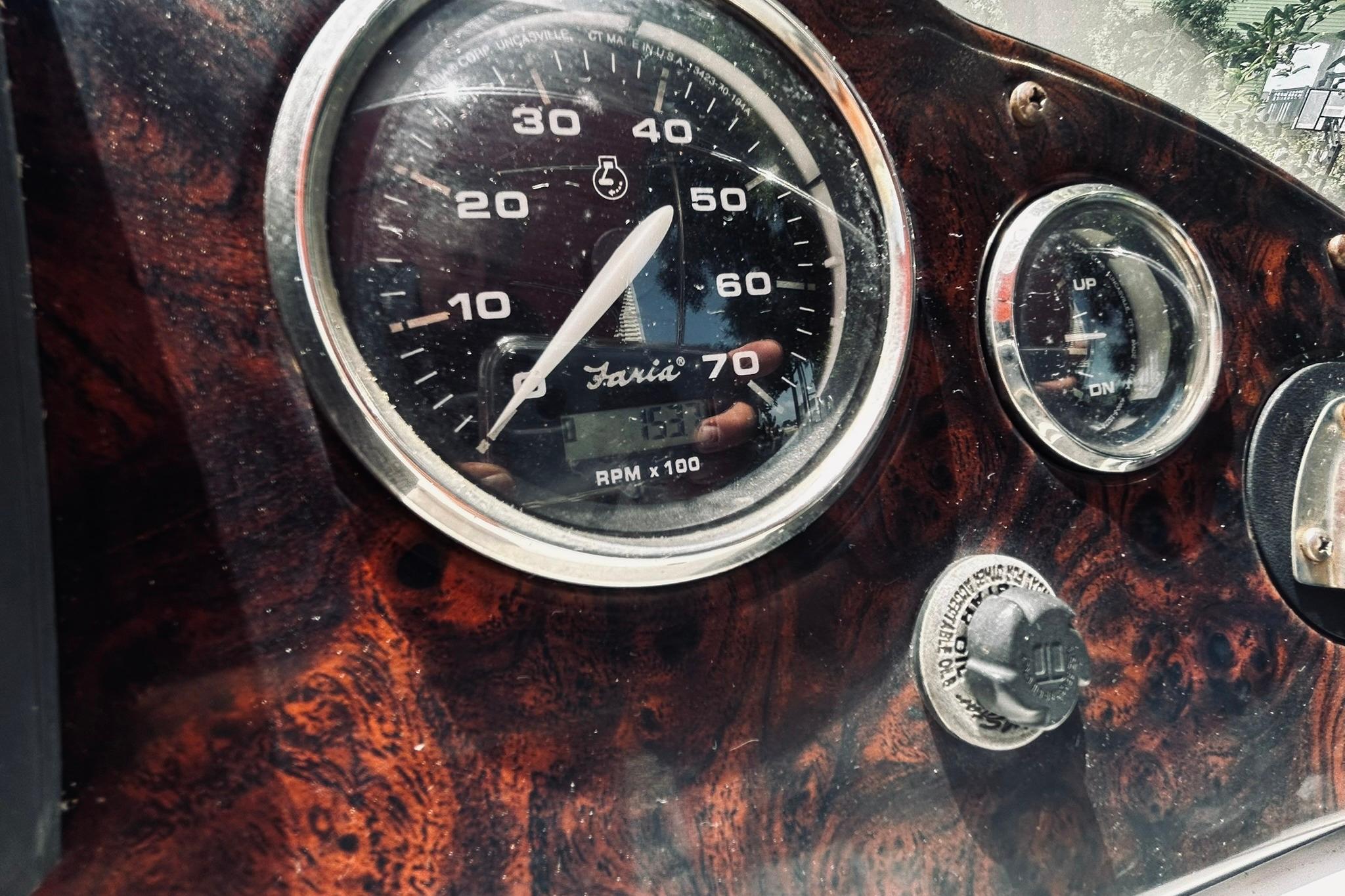 Dashboard of a 2013 Hurricane SunDeck Sport 201 OB boat, featuring gauges and controls.