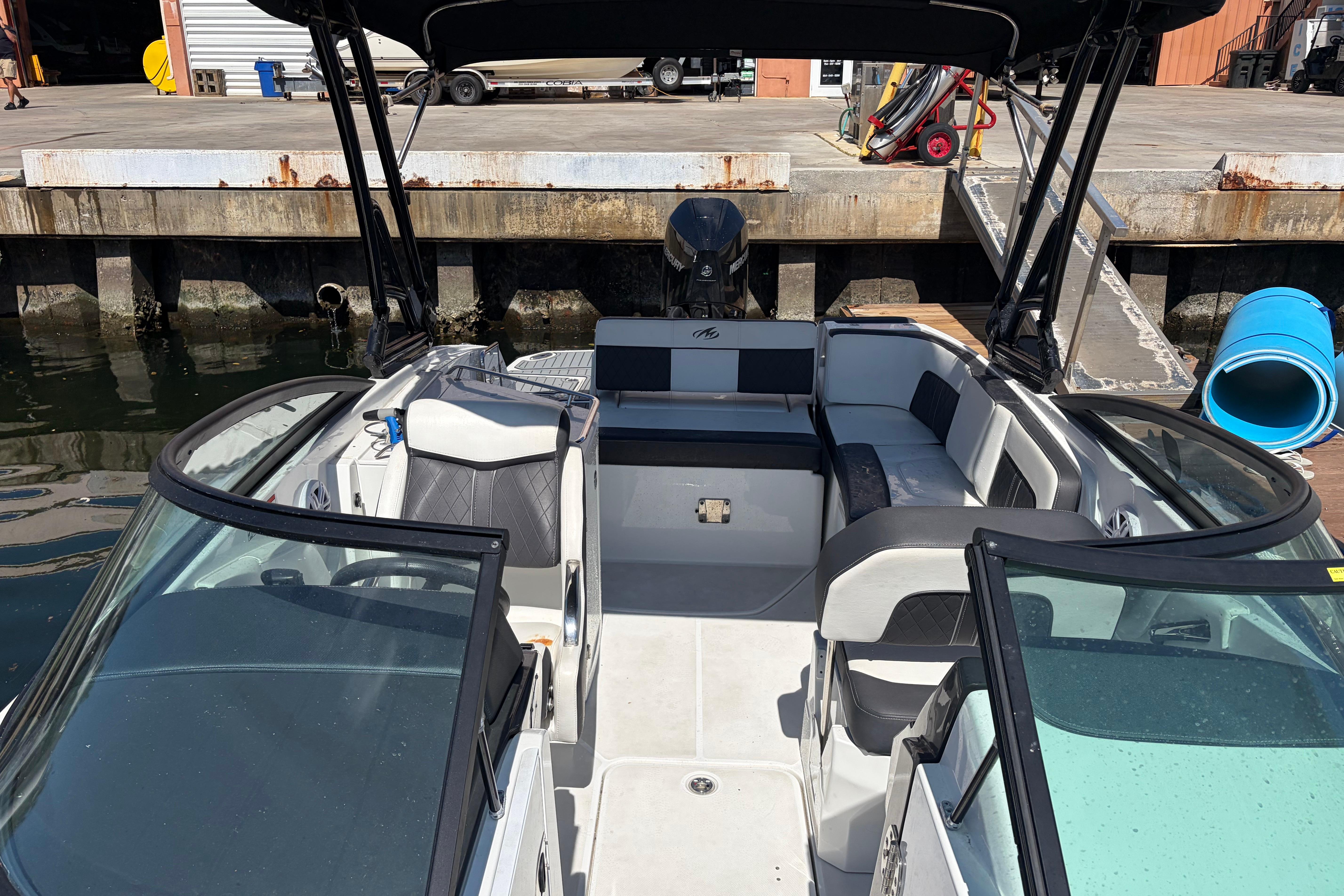 2022 Monterey M-65 boat interior at dock, featuring spacious seating and modern design.