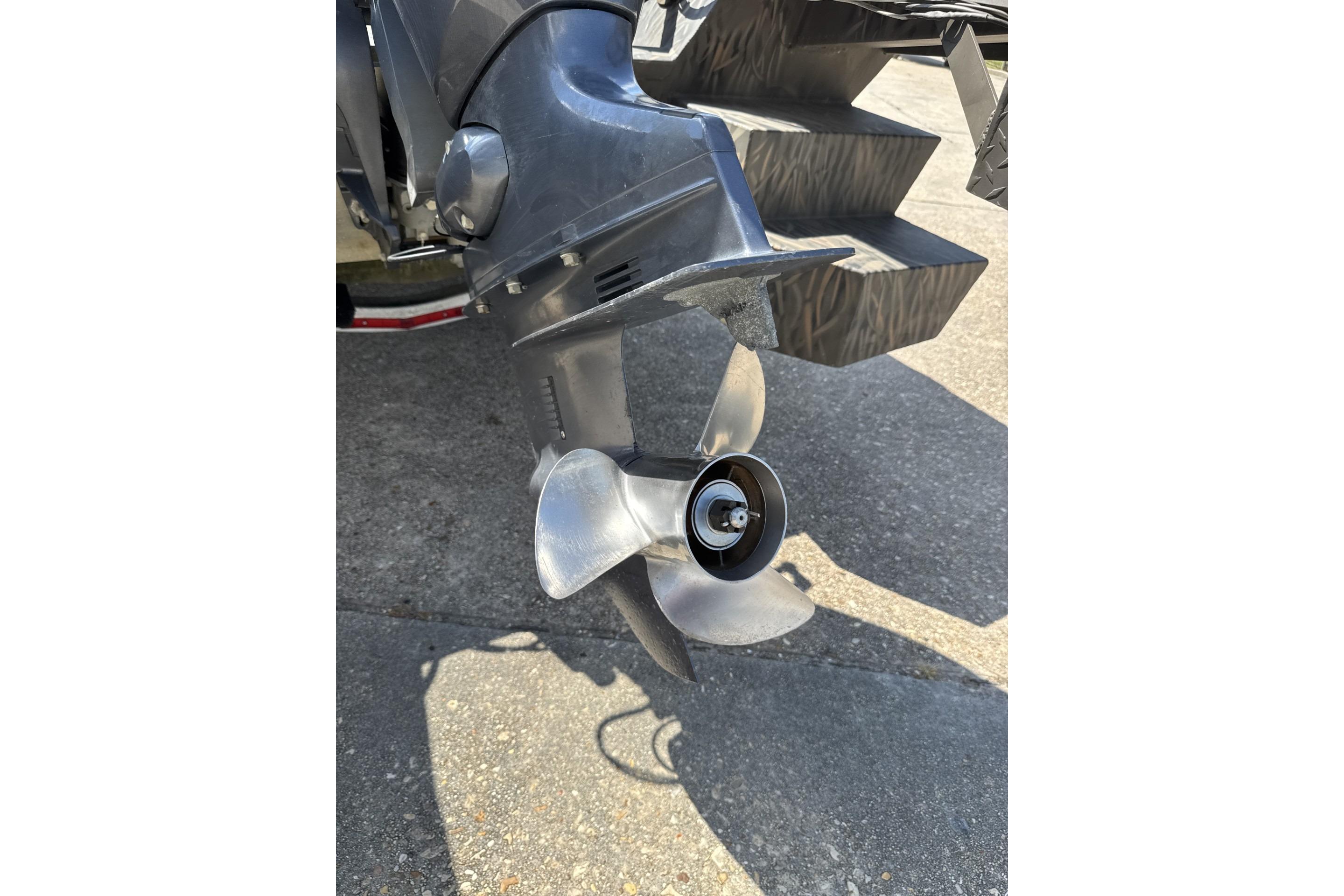Propeller of 2022 Alweld 2270 Large Flat Bottom boat on concrete surface.