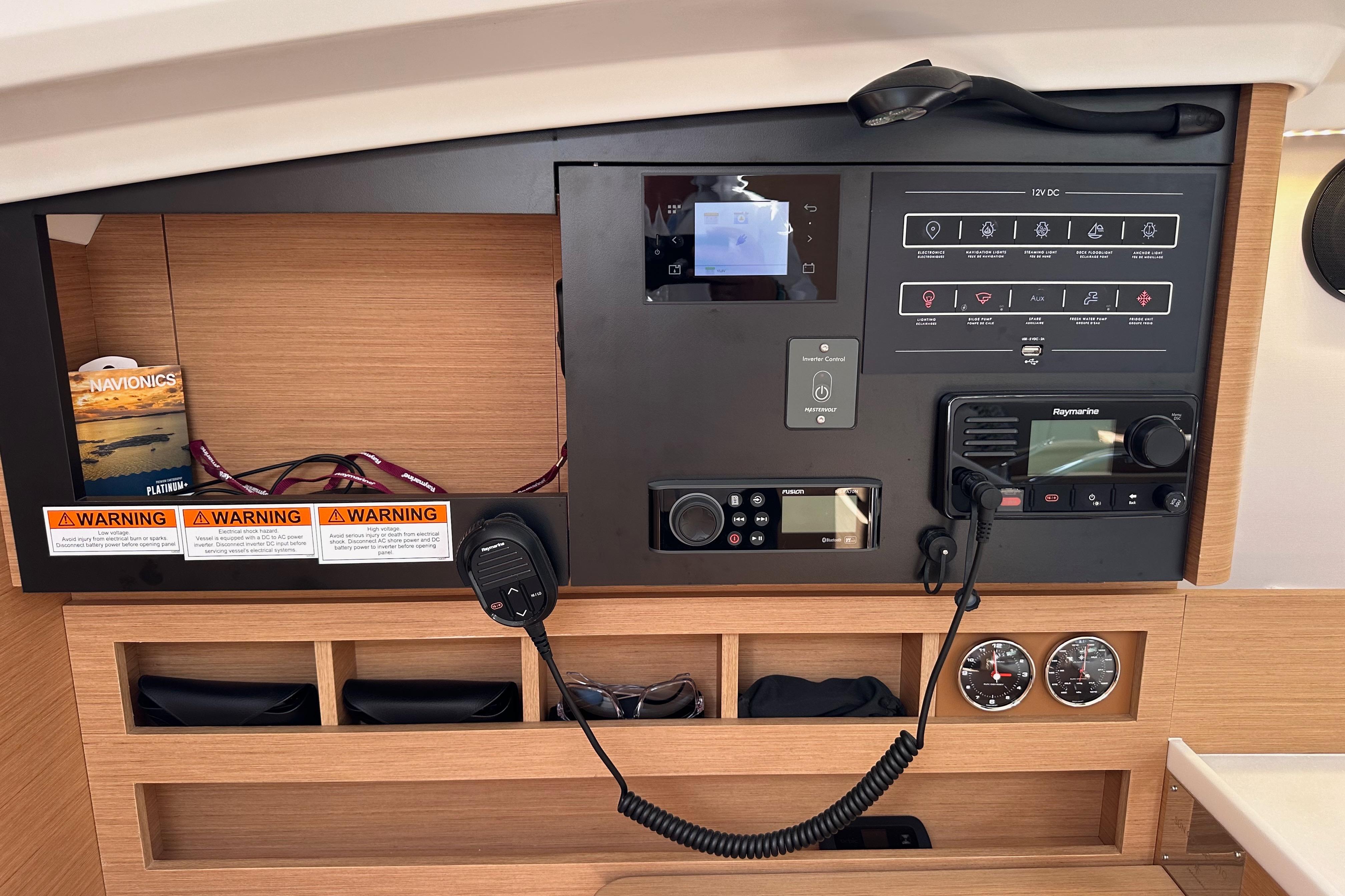 Control panel of 2024 Jeanneau Sun Odyssey 410 yacht with navigation and communication equipment.