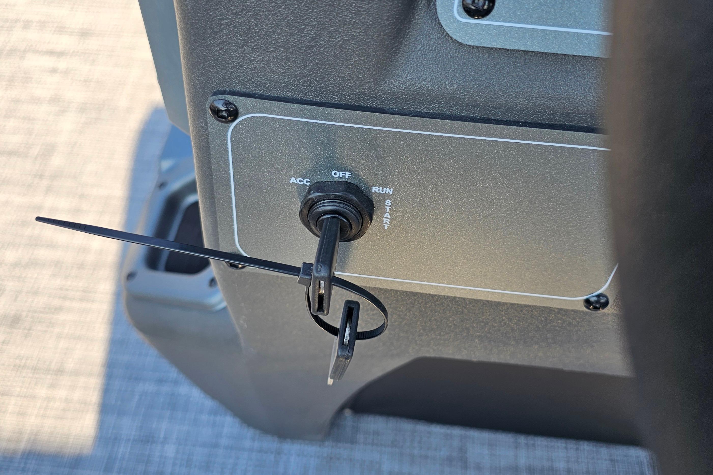Ignition switch of 2026 Sun Tracker Party Barge 16 DLX with key inserted.