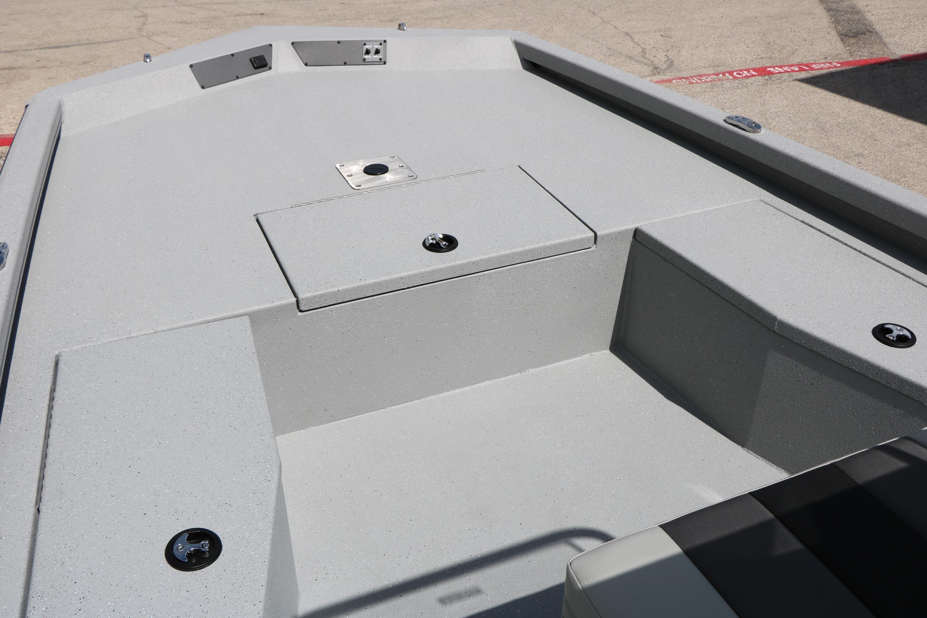 2026 Vexus Defender 201 boat deck with storage compartments and sleek design.