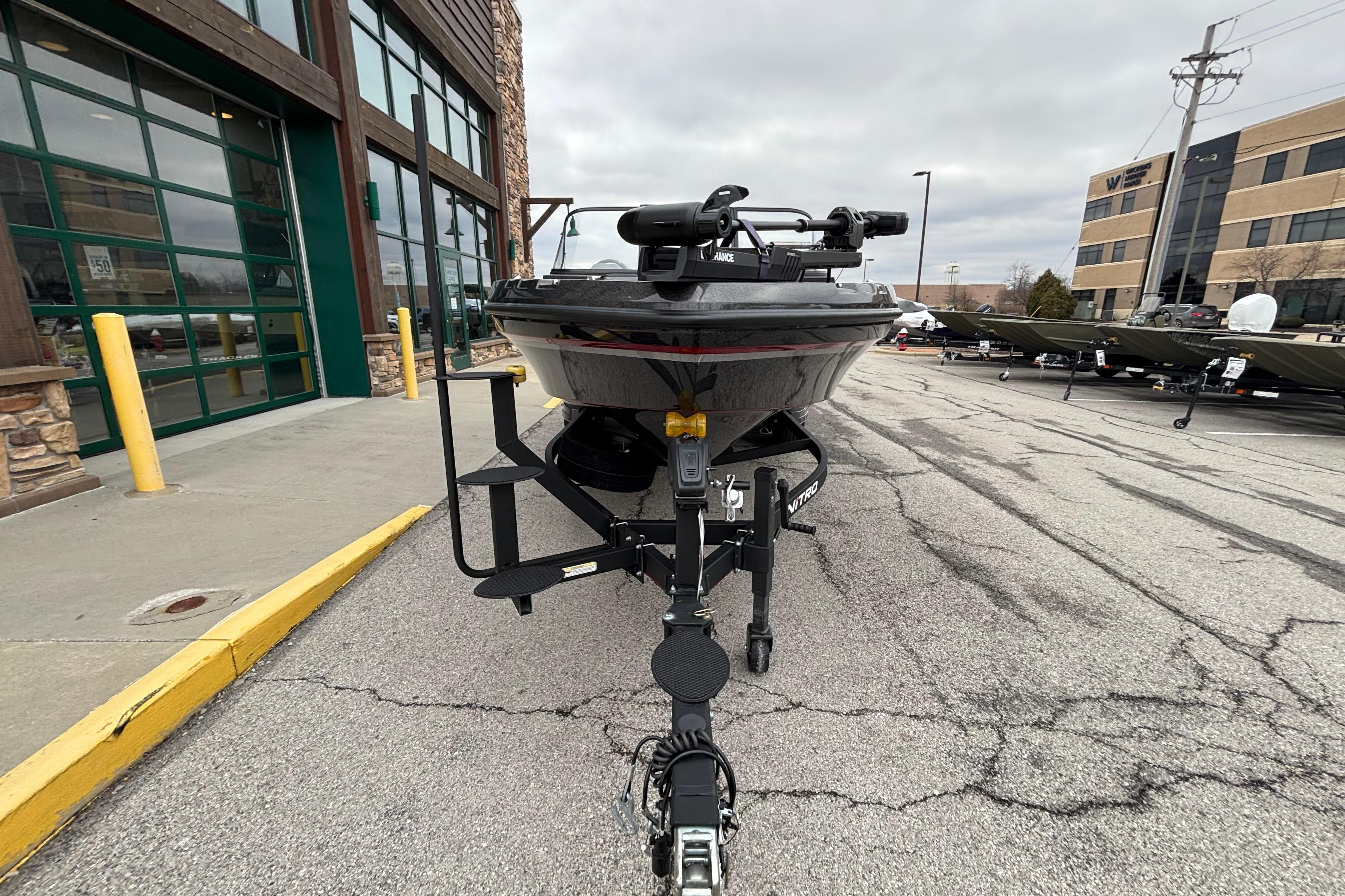 2024 Nitro ZV21 Pro boat on trailer outside dealership.