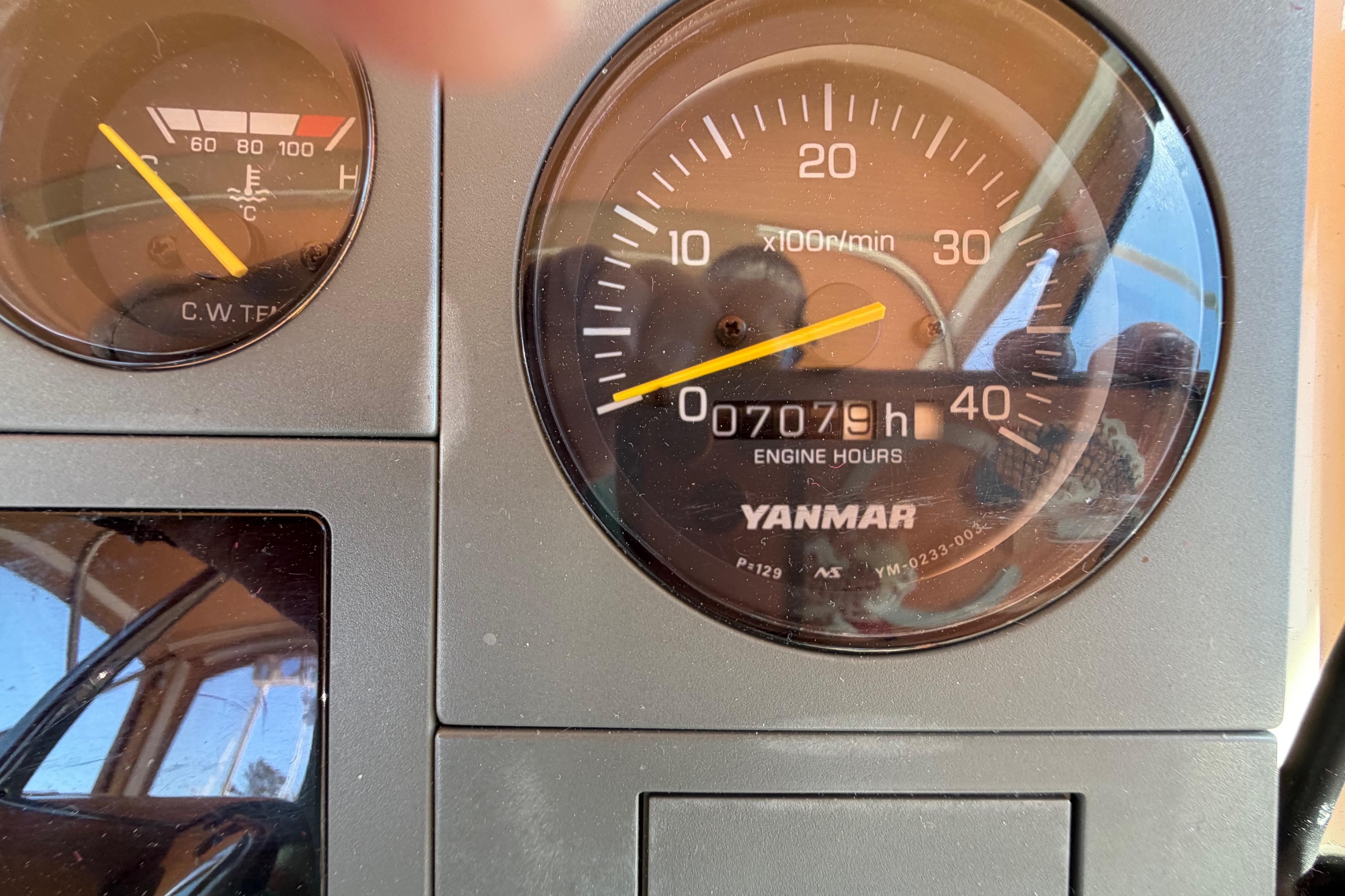 Close-up of Yanmar engine hour meter showing 7079 hours on a 2000 Sabreline 36 Express.