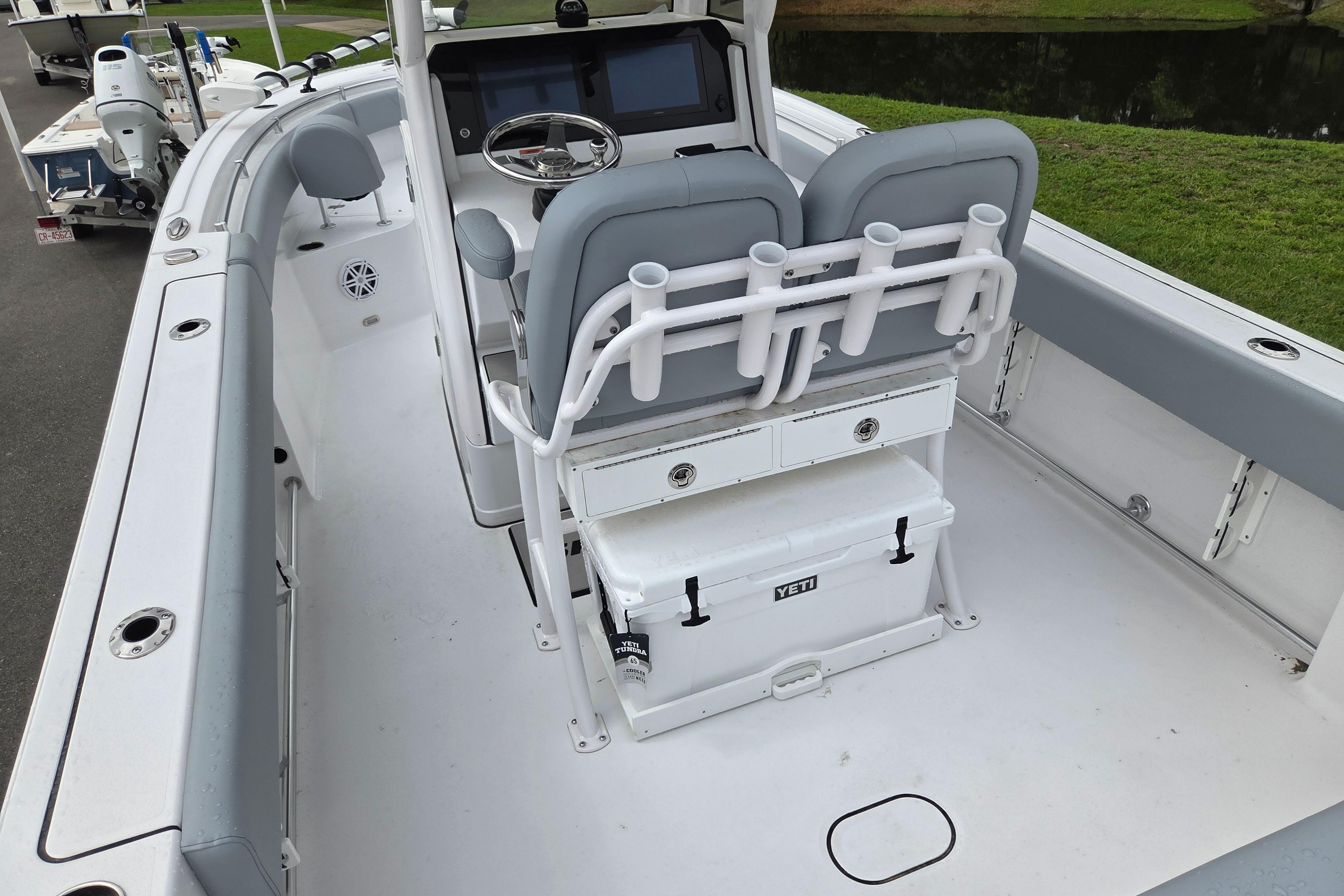 2026 Sportsman Open 232 Center Console boat interior with seating and storage.