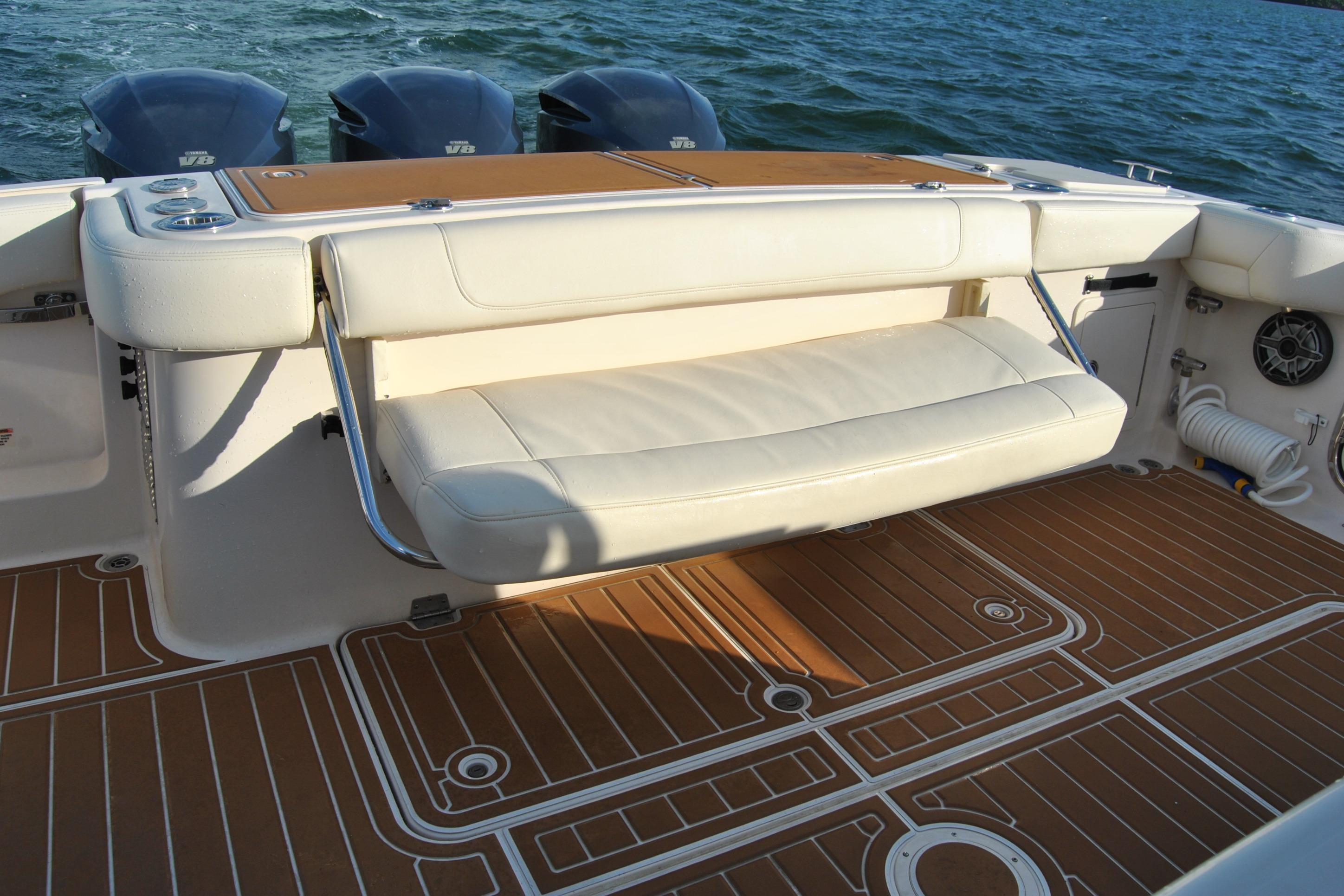 2018 Grady-White Canyon 376 boat interior with cushioned seating and teak-style flooring.