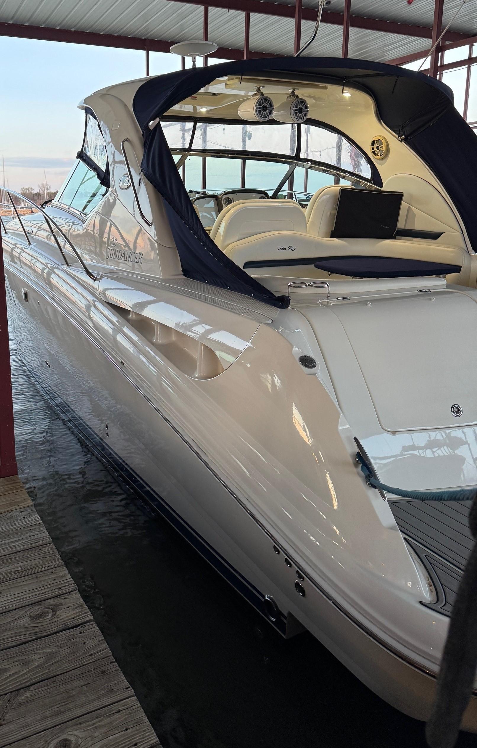 2007 Sea Ray 38 Sundancer yacht docked in a marina, showcasing sleek design and luxury features.