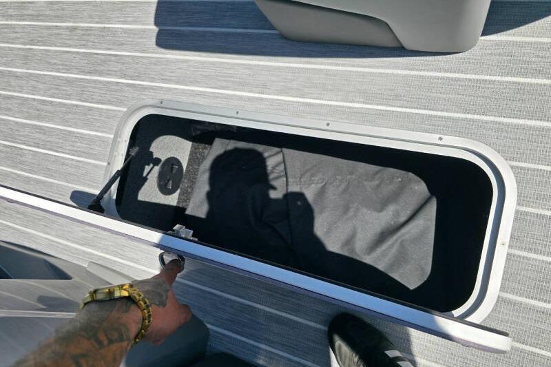 Open storage compartment on 2026 Berkshire STS Arch Performance Series boat deck.