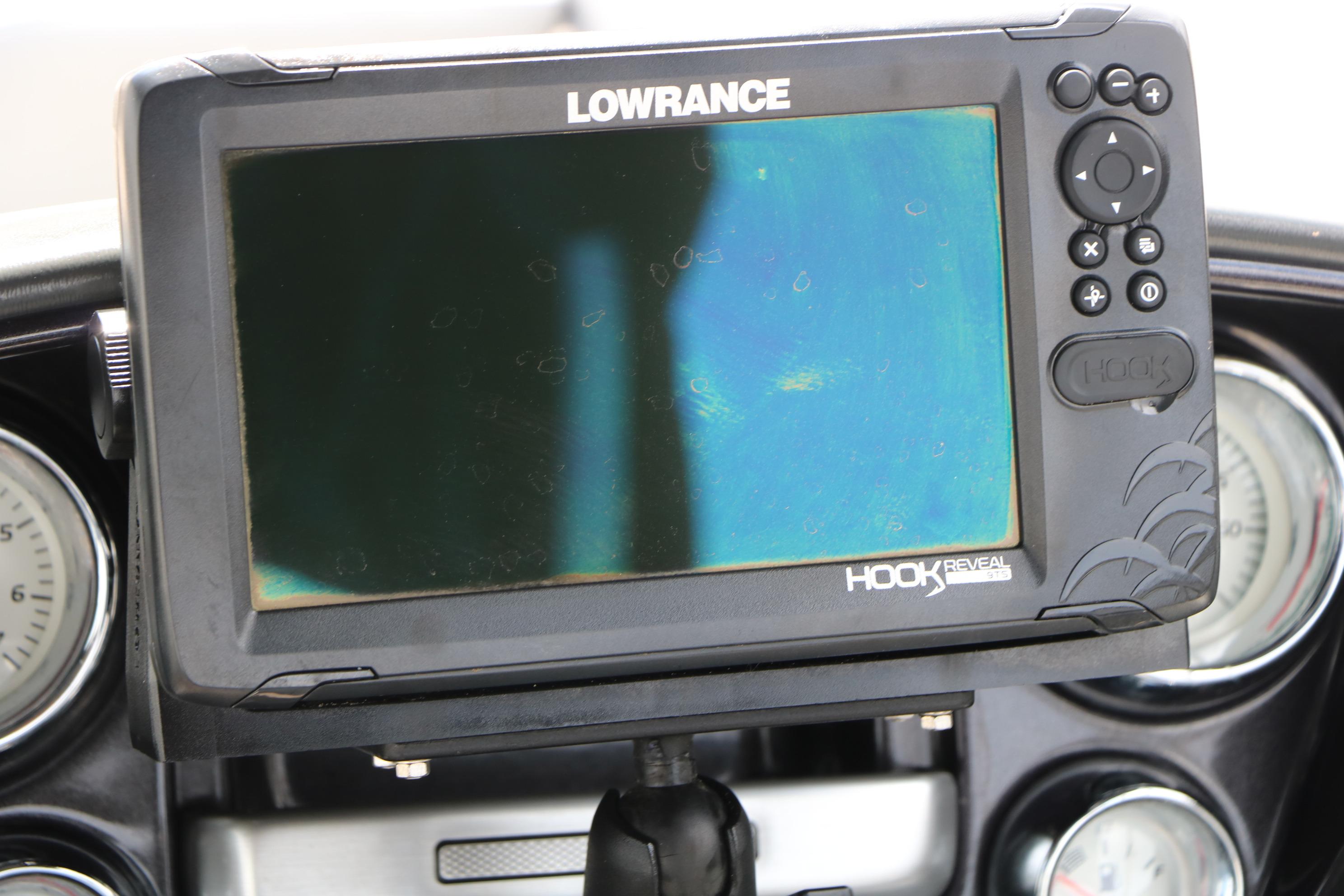 Lowrance Hook Reveal fish finder on 2021 Ranger 223FC boat dashboard.