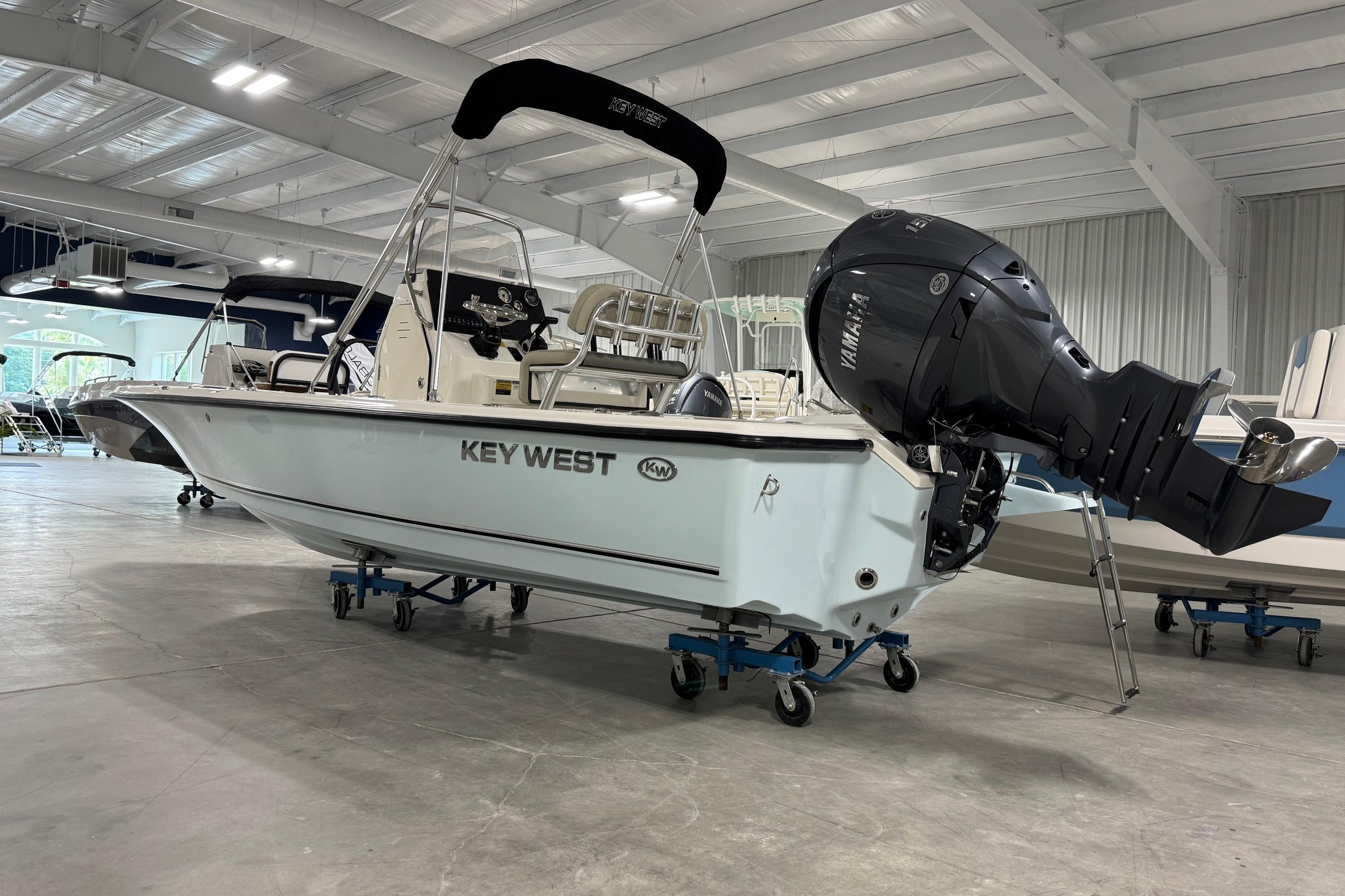 2026 Key West 210 Bay Reef boat with Yamaha outboard motor in showroom.