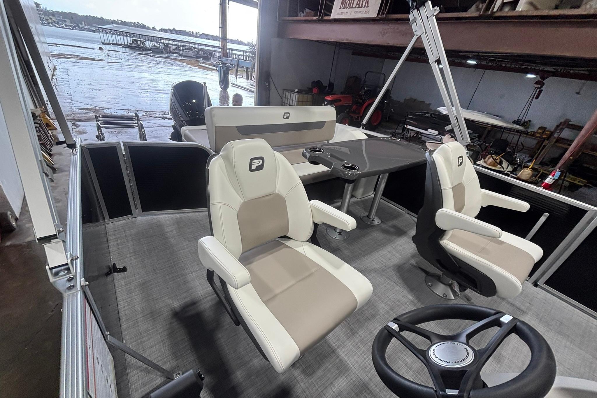 2025 Princecraft Vectra 21 RL pontoon boat interior with seating and steering wheel.