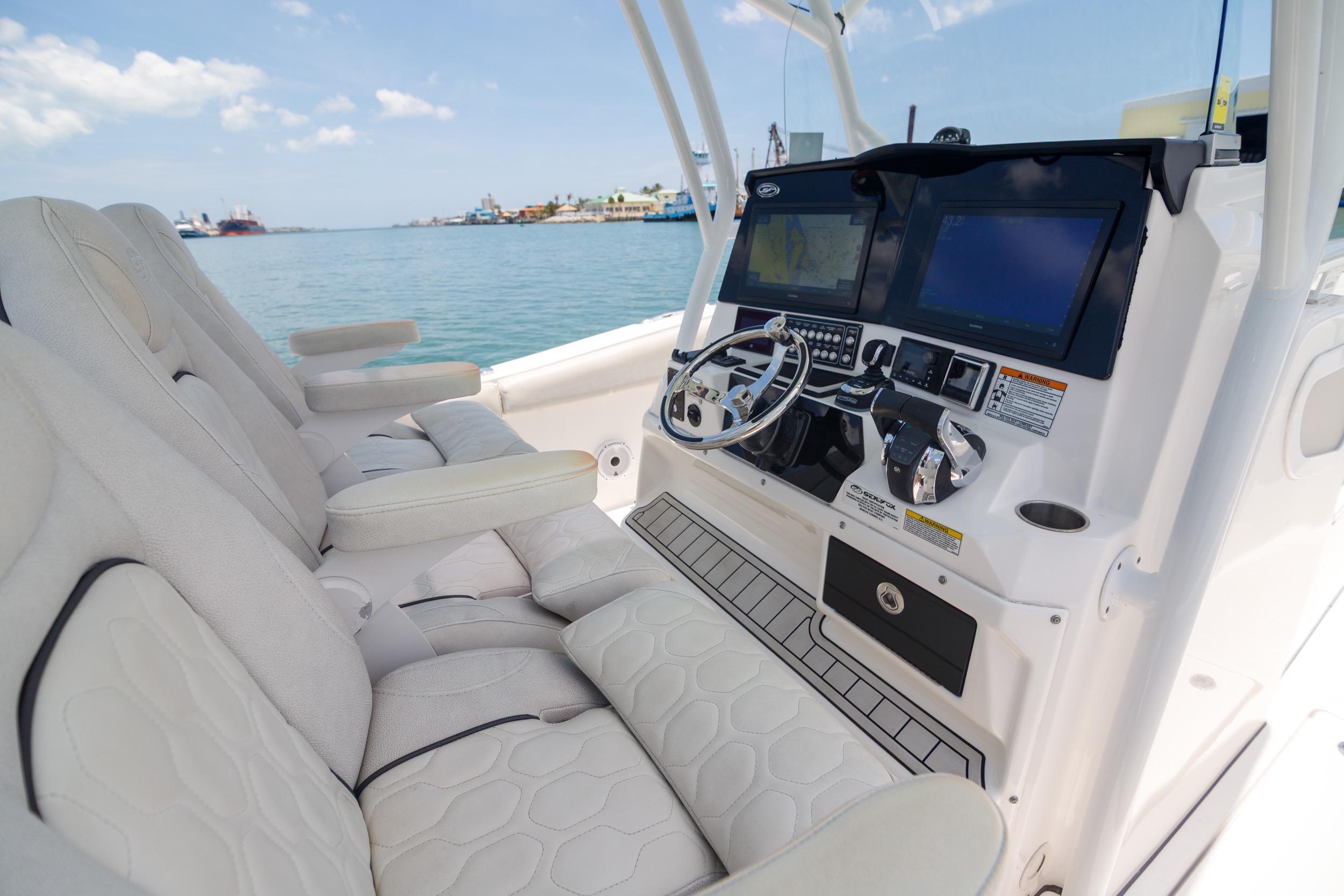 Interior view of 2021 Sea Fox 328 Commander boat cockpit with modern controls and seating.