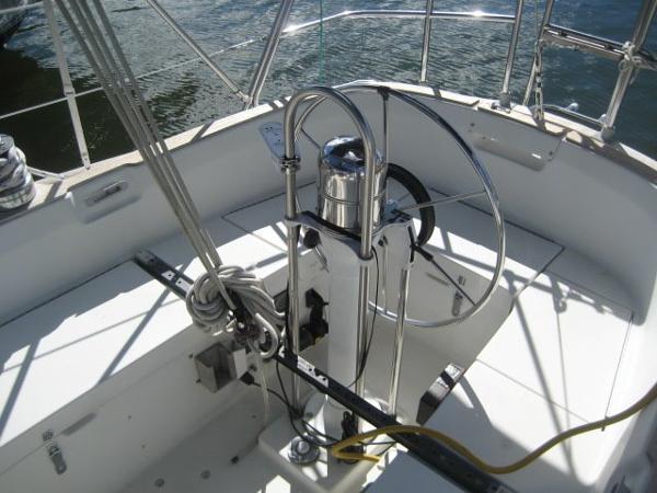The cockpit of a 1984 C&C Landfall with a steering wheel and rigging.