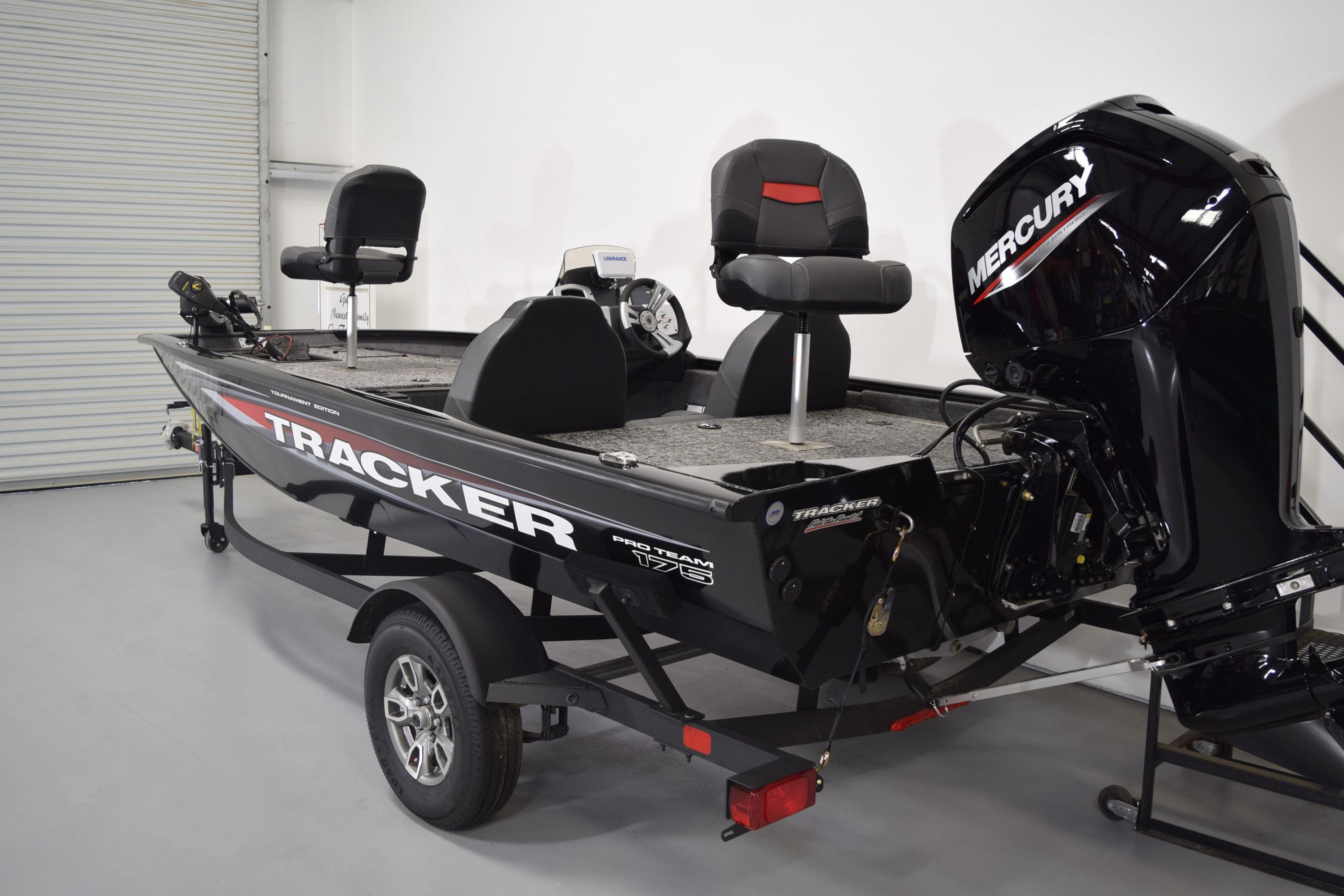 2026 Tracker Pro Team 175 boat with Mercury engine in a showroom.