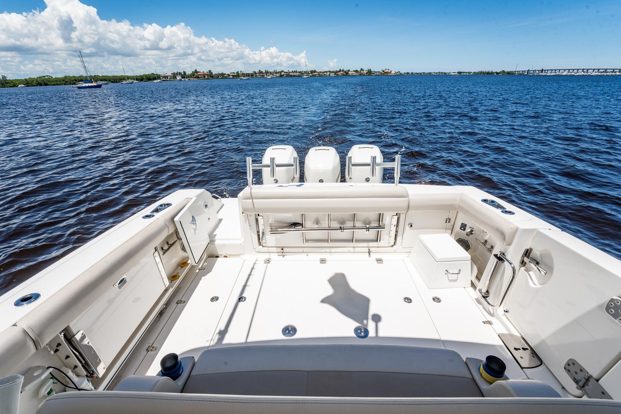2018 Boston Whaler 380 Outrage boat deck with ocean view, clear sky, and calm waters.