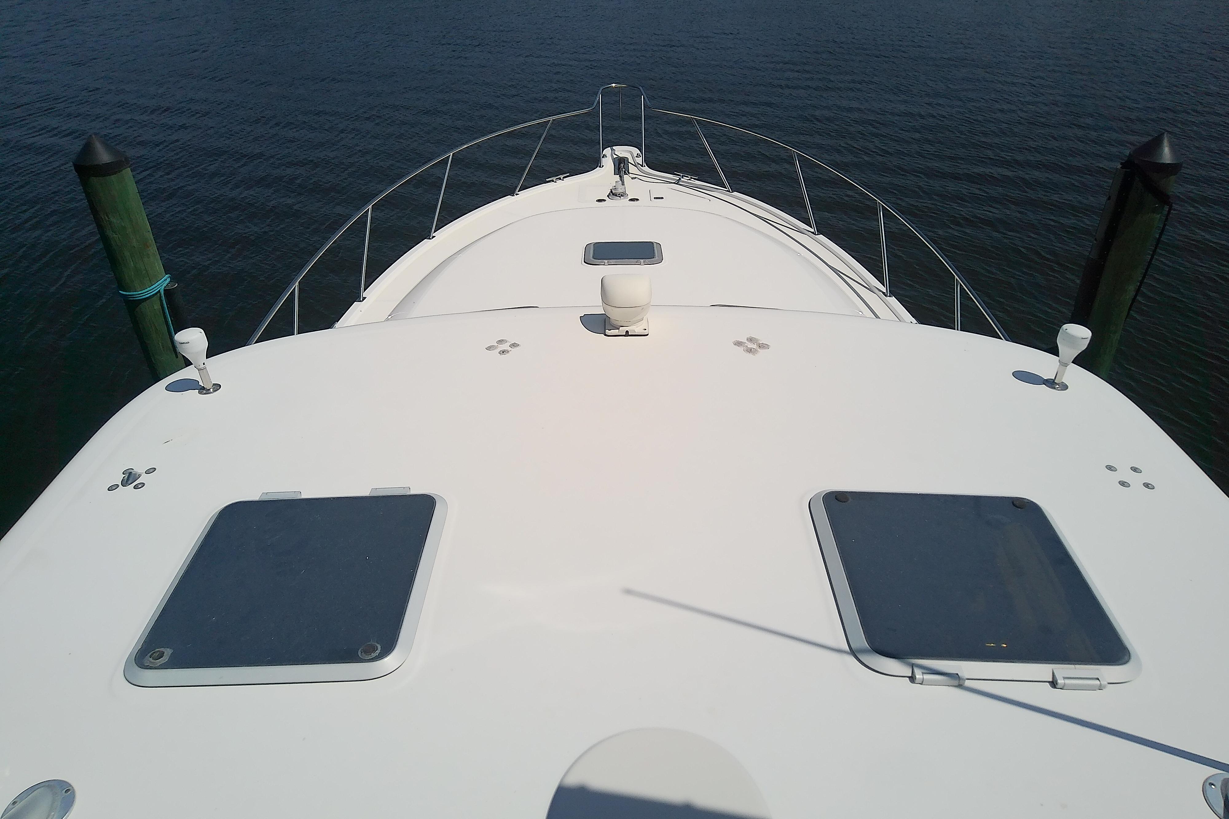 Bow view of 2000 Tiara Yachts 4100 Open on calm water.