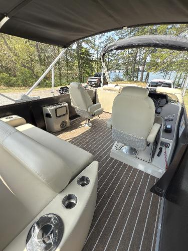 2022 Premier 250 Solaris boat interior with seating, steering console, and cup holders.