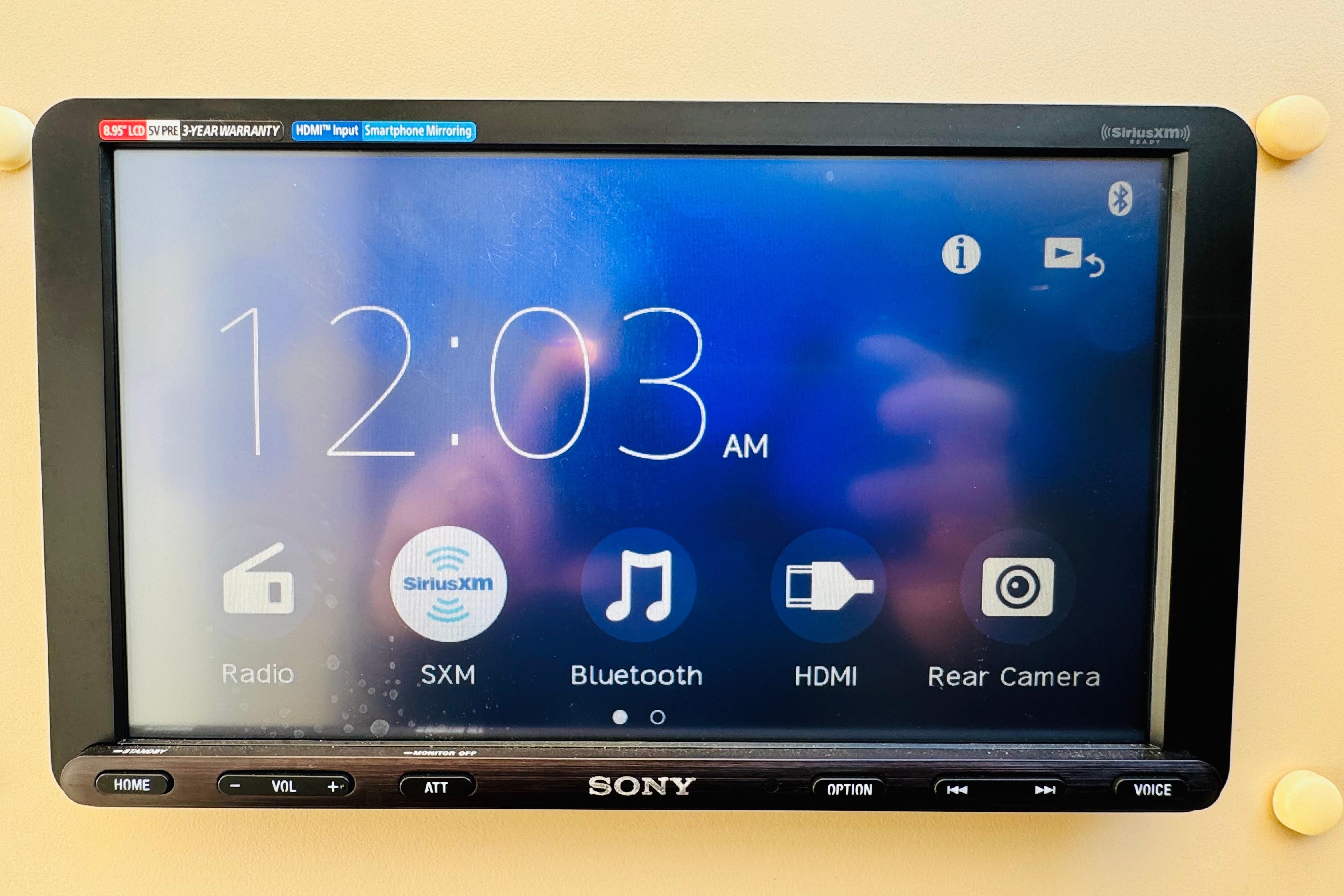 Sony touchscreen display on a 2000 Cruisers Yachts 3575 Express, showing time and media options.