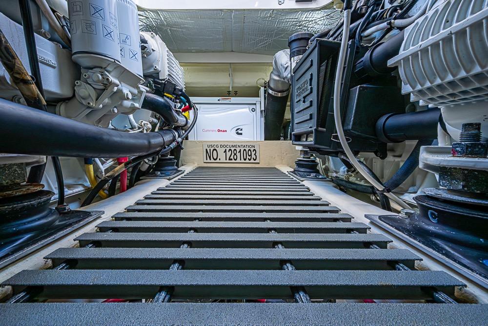 Engine room of a 2017 Tiara Yacht coupe, featuring Cummins Onan generator.