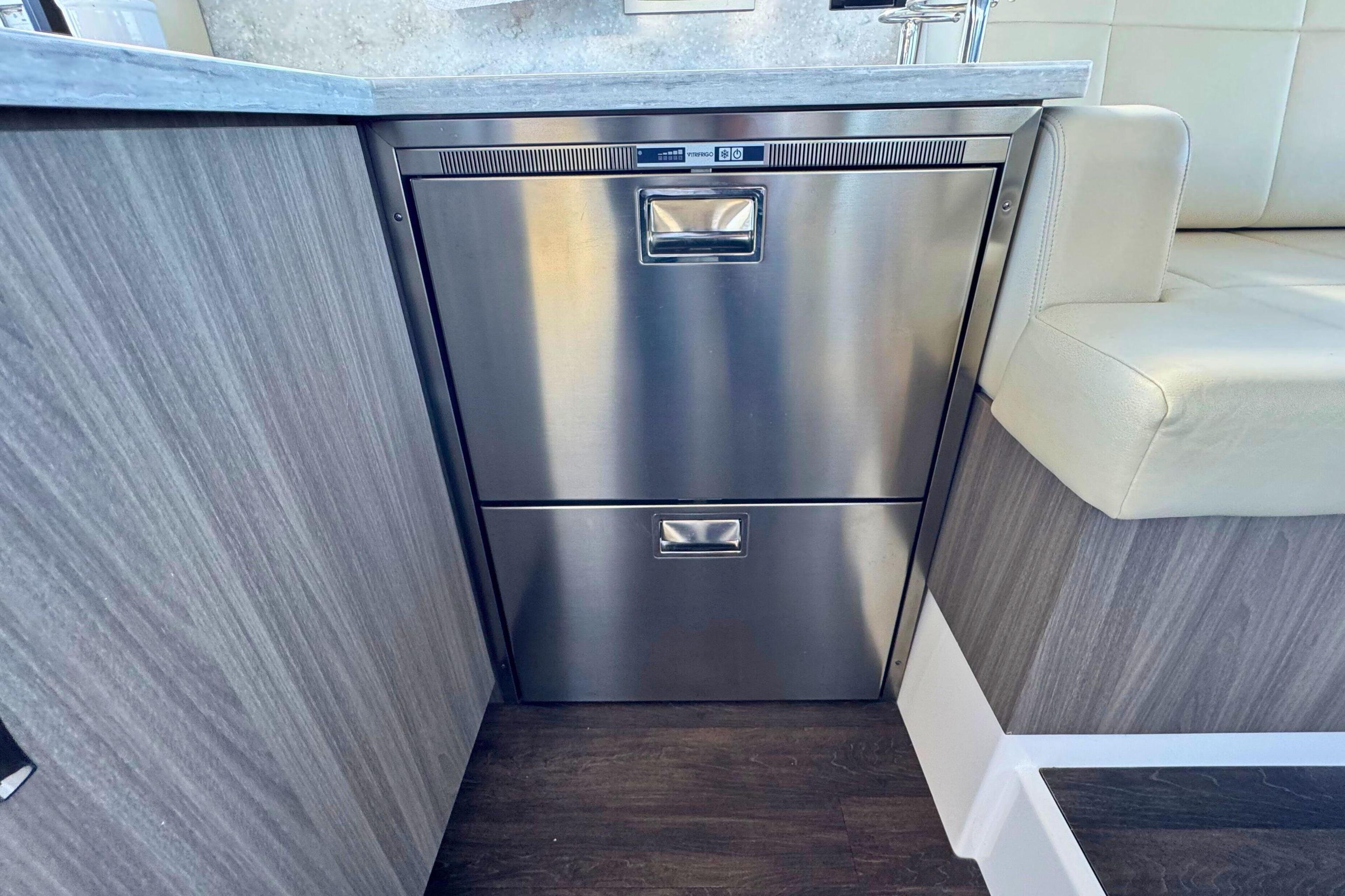 Stainless steel drawers in 2021 Regal 38 Grande Coupe interior, featuring modern design and wood accents.