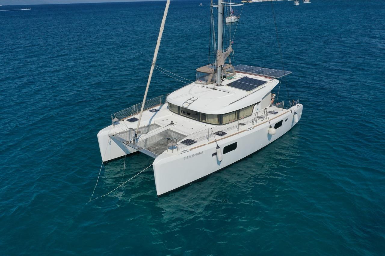 2016 Lagoon 39 catamaran sailing on clear blue ocean waters.