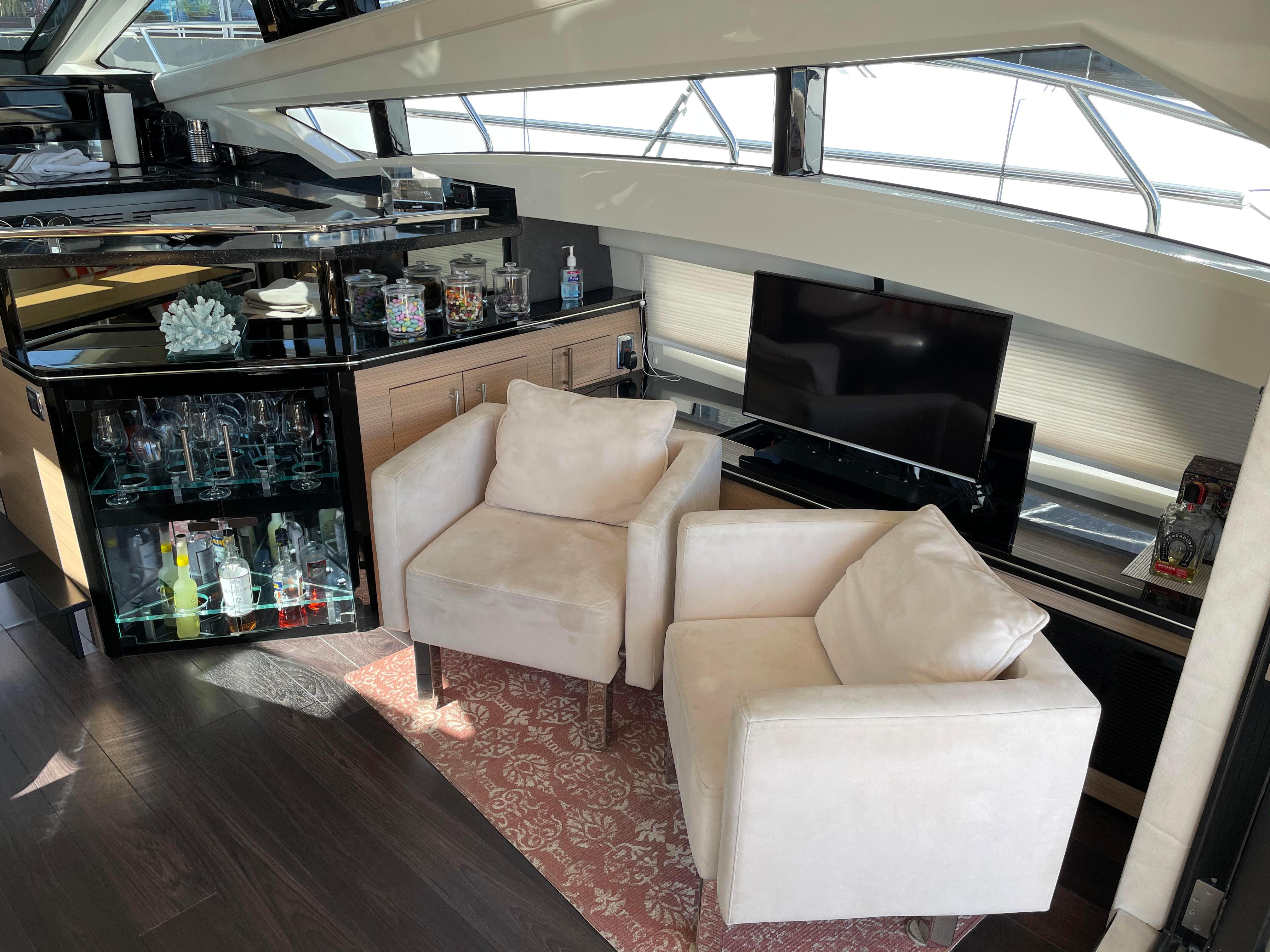 Luxurious interior of 2011 Marquis Sport Coupe yacht with plush seating and modern amenities.