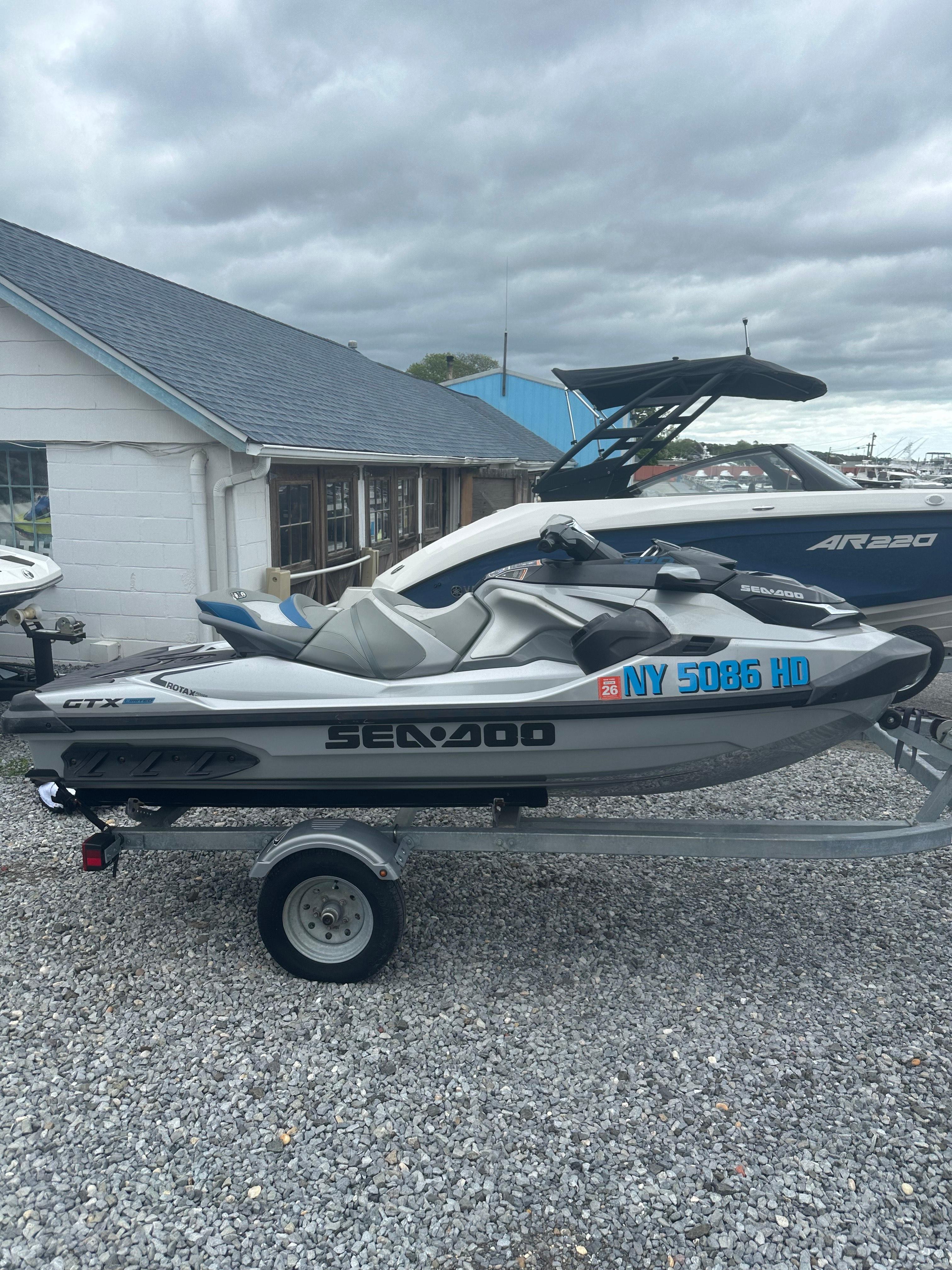 2020 Sea-Doo GTX Limited 300 on trailer, parked outdoors on gravel.