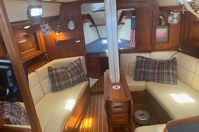 Luxurious 2001 Tartan 3700 yacht interior with plush seating and elegant wood finishes.