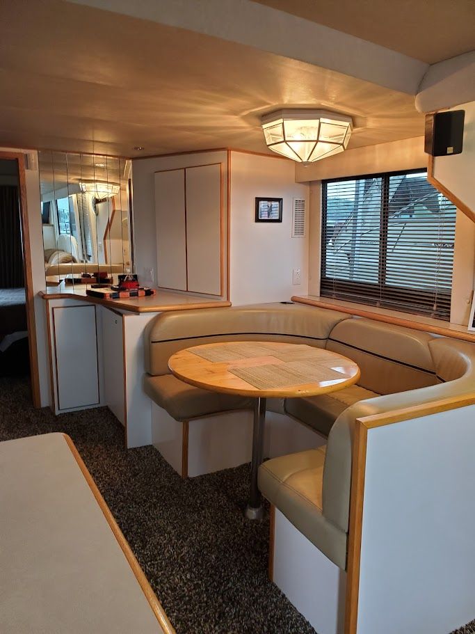 Interior of a 1996 Blue Water Motor Yacht with dining area.