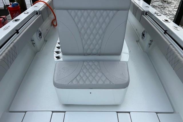 2023 Contender 32 ST boat interior with diamond-stitched seating and rod holders.