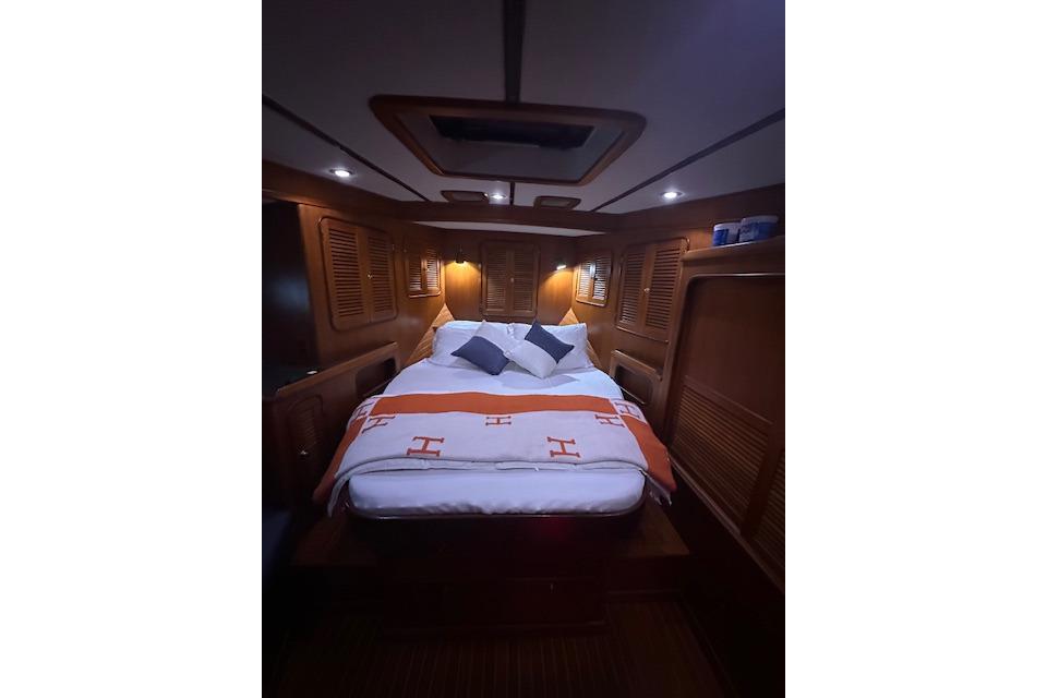Interior of a 1998 Nordhavn 46 yacht featuring a cozy bedroom.
