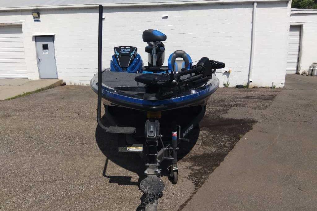 2026 Nitro Z19 XL Pro boat parked outdoors, featuring advanced Garmin equipment.