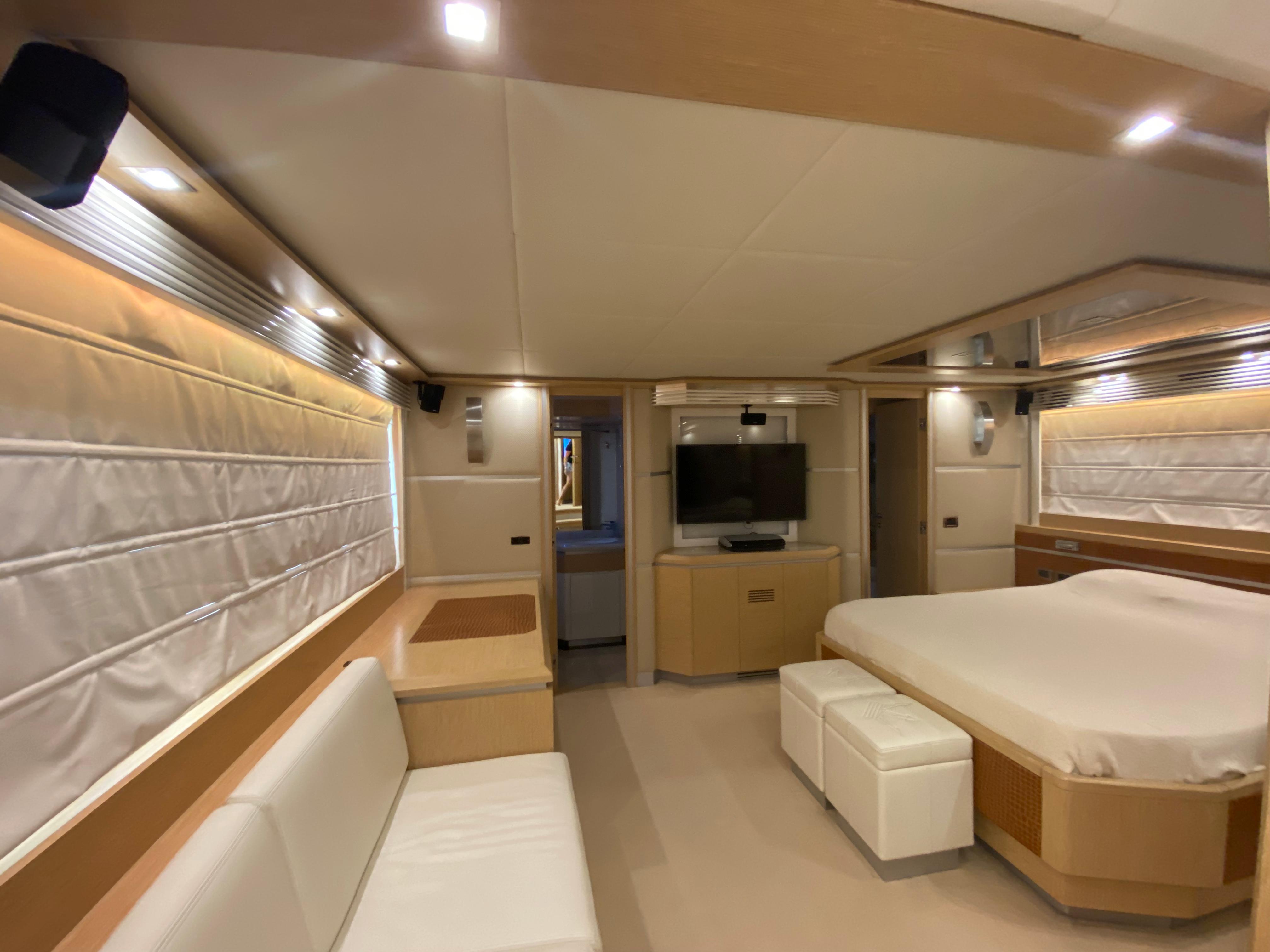 Luxurious interior of 2008 Dominator 680 yacht with modern furnishings and ambient lighting.