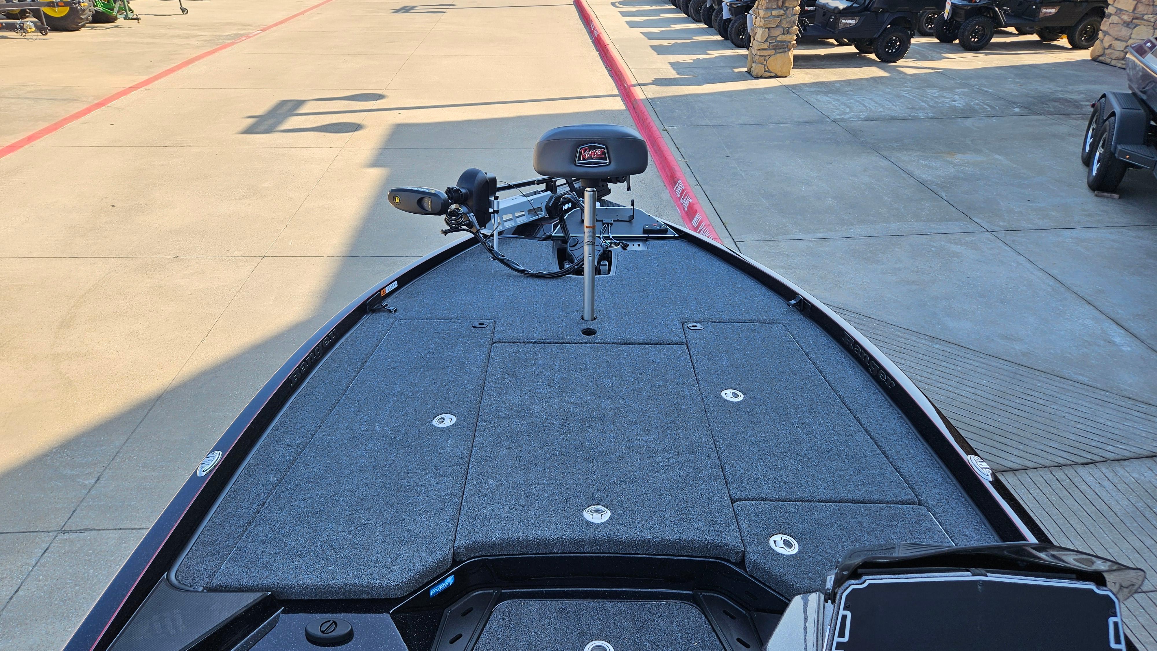 2025 Ranger Z520 boat deck with seating and equipment, parked outdoors.