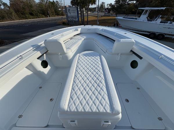 2025 Yellowfin 39 Offshore boat with white cushioned seating and storage compartments.
