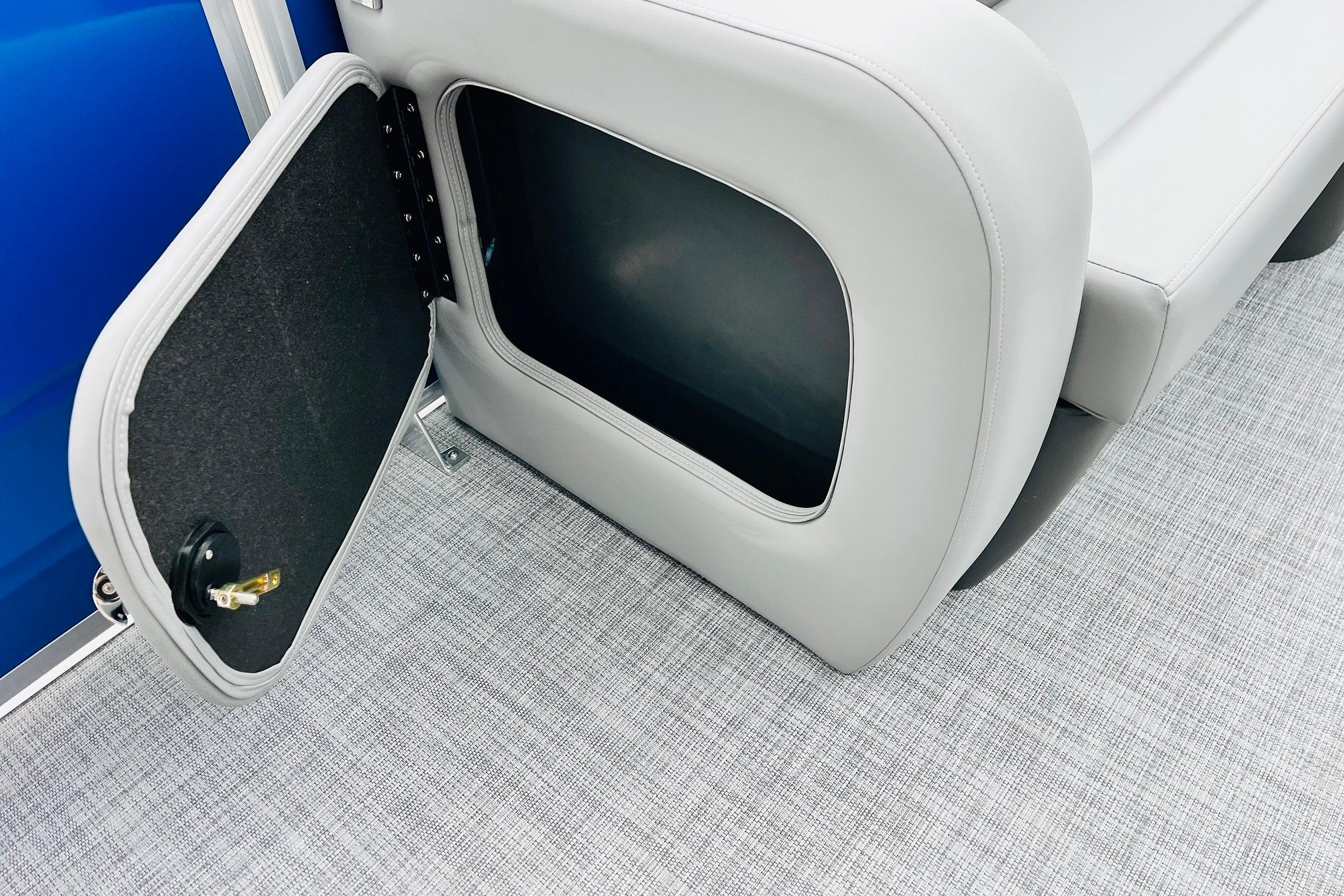 Open storage compartment on 2026 Sun Tracker Party Barge 22 RF DLX pontoon boat.