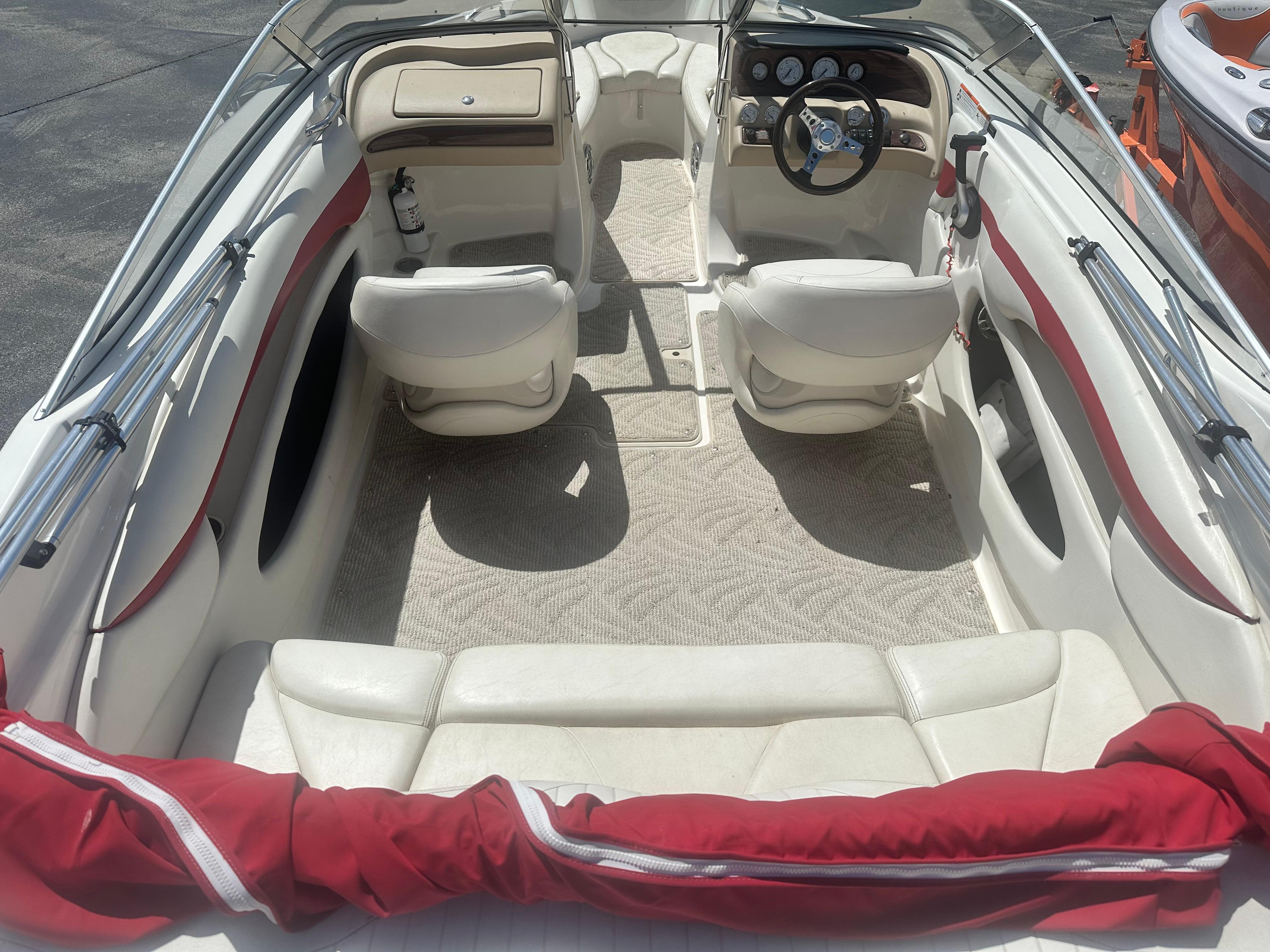 2008 Glastron 205 GX boat interior with white seating and red accents.