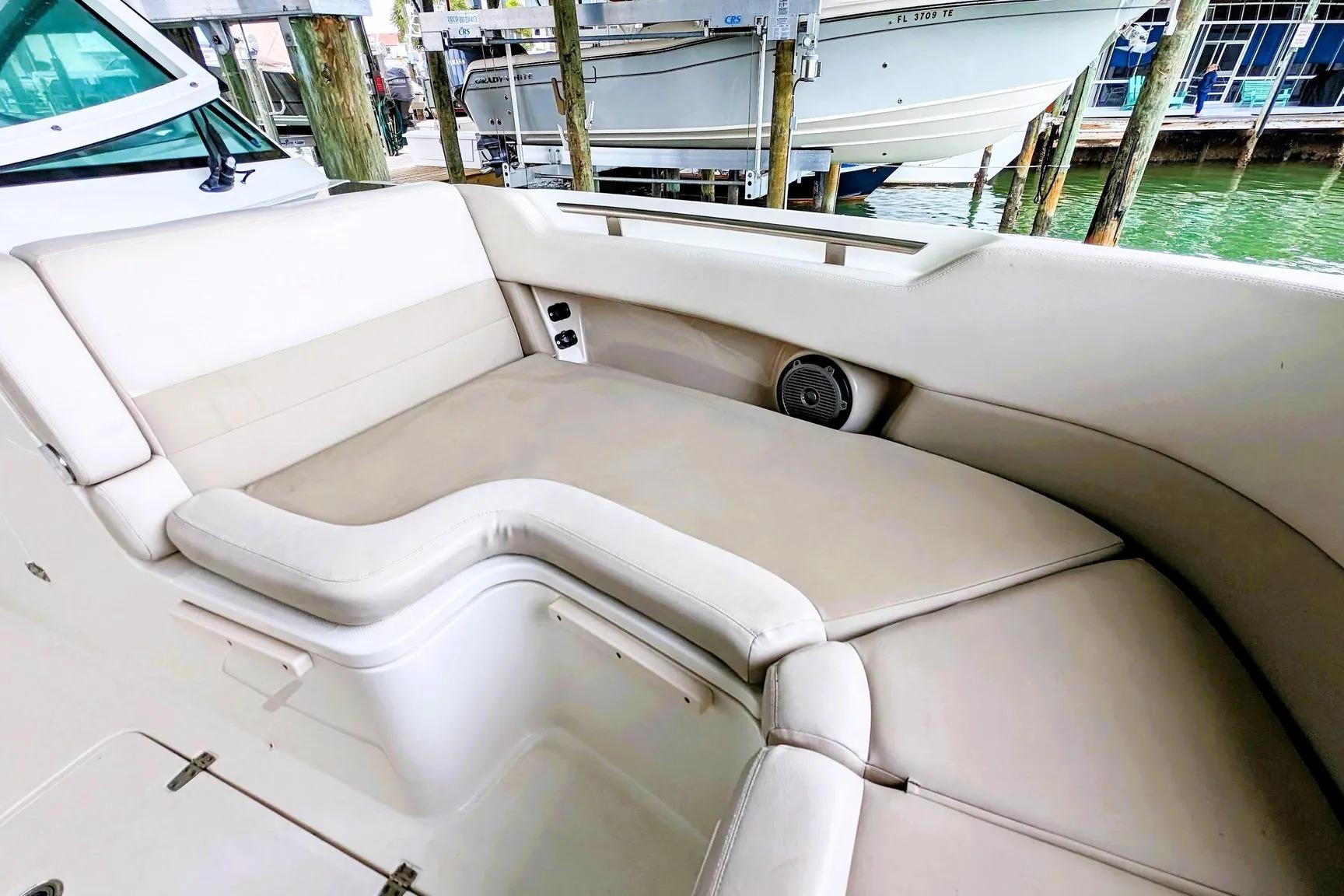2017 Boston Whaler 320 Vantage boat interior with cushioned seating and speaker.