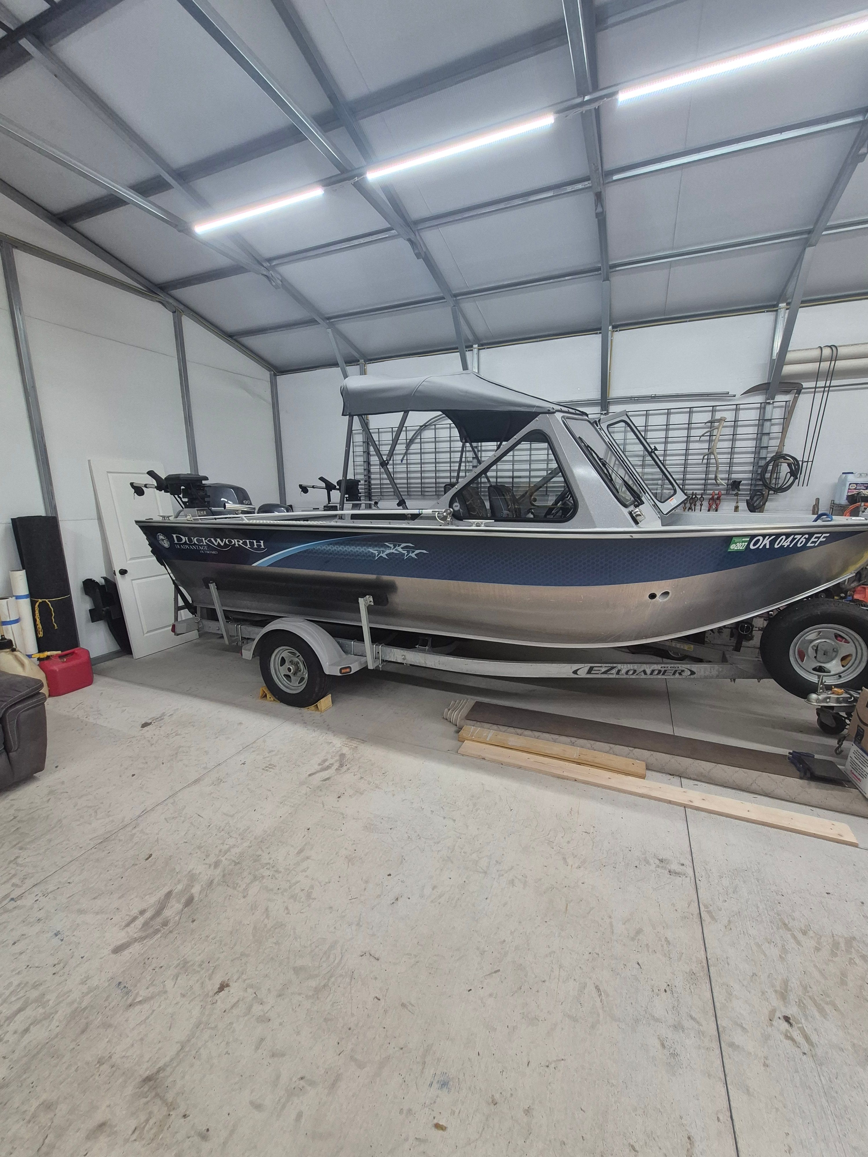 A 2016 Duckworth 18 Advantage boat in a garage.