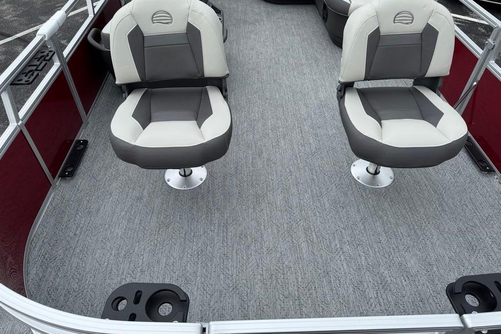 2026 Sun Tracker Bass Buggy 16 XL Select interior with swivel seats and carpeted flooring.