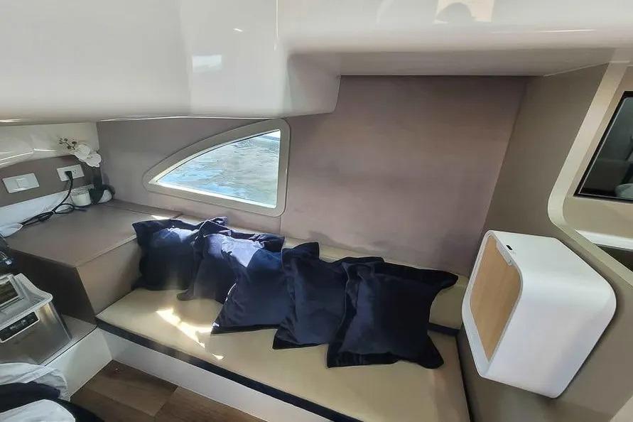 Luxurious interior of 2024 Hanover 387 yacht with plush seating and modern design.