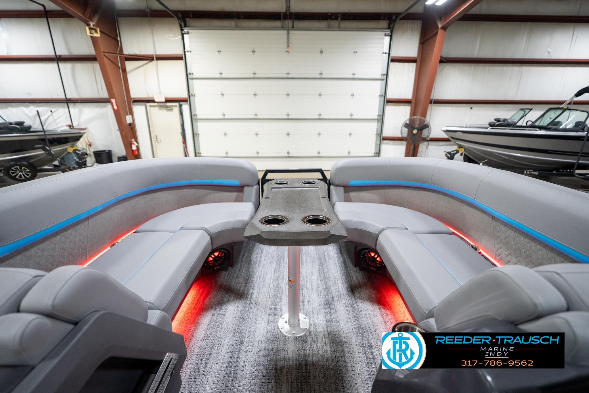 Luxurious interior of 2026 Bennington 22 MFB pontoon boat with LED lighting and plush seating.