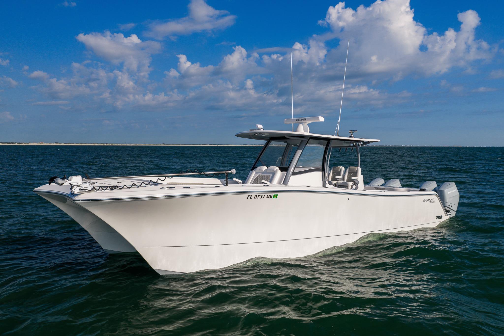 2026 Front Runner 37 Catamaran cruising on open water under a clear blue sky.