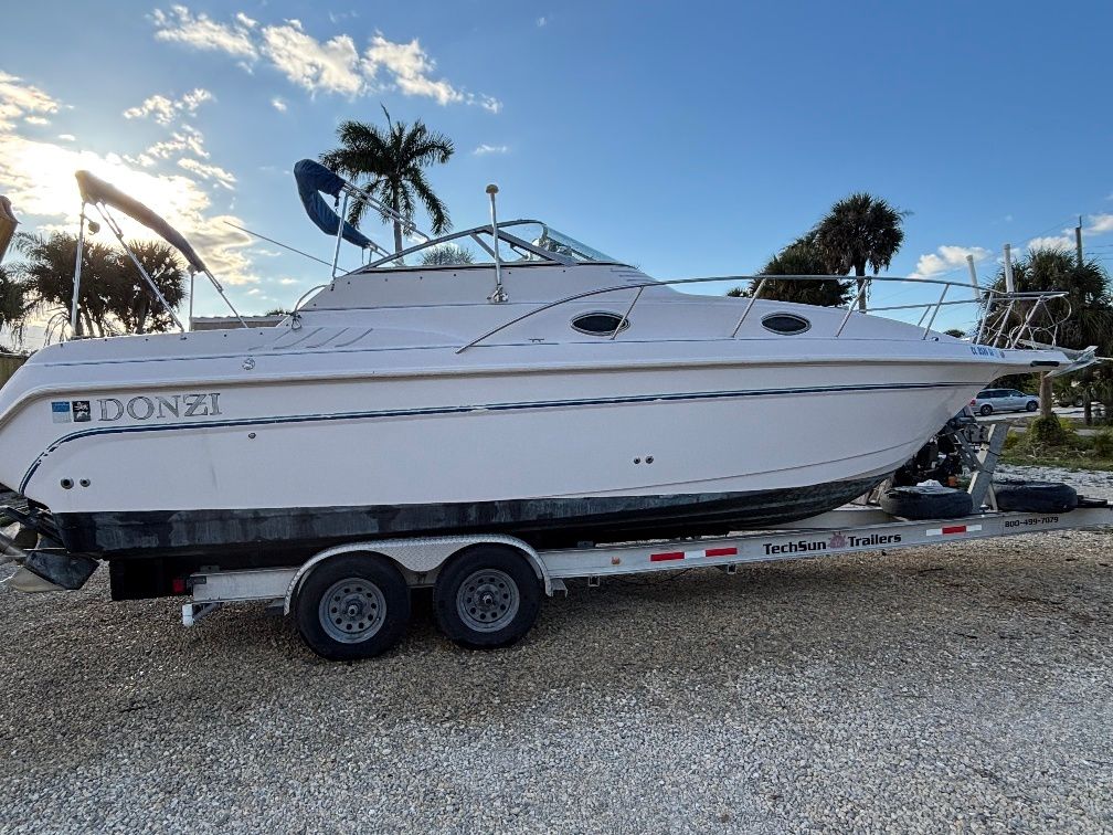 1997 Donzi 275LXC boat on trailer at sunset.