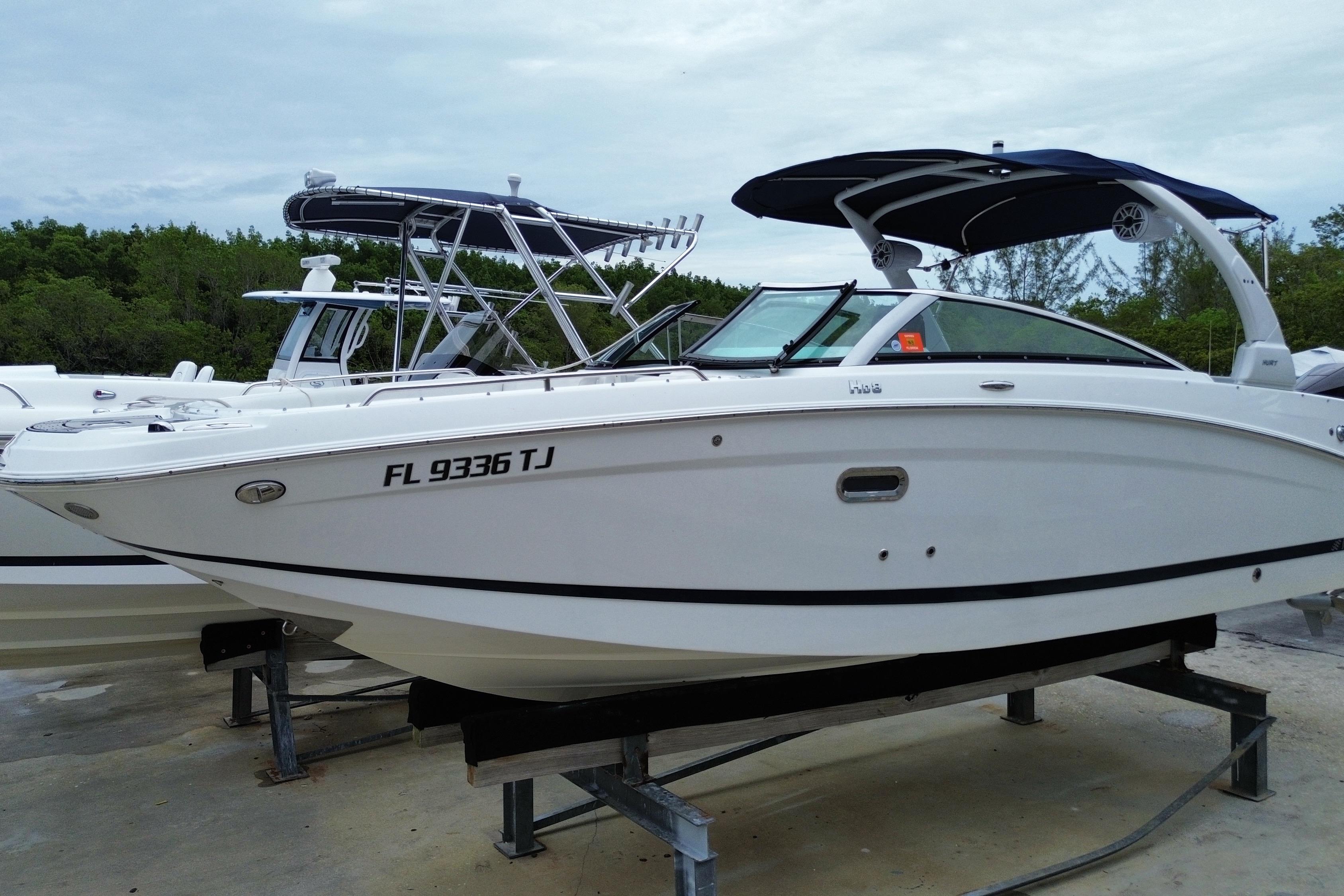 2022 Four Winns HD8 OB boat with sleek design, docked on a platform.
