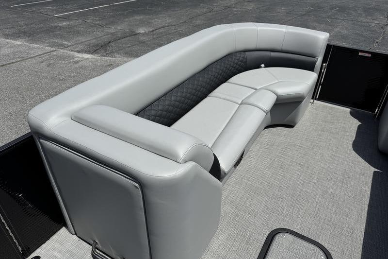 Luxurious seating on 2026 Manitou Encore 25 SL SHP pontoon boat, featuring sleek gray upholstery.